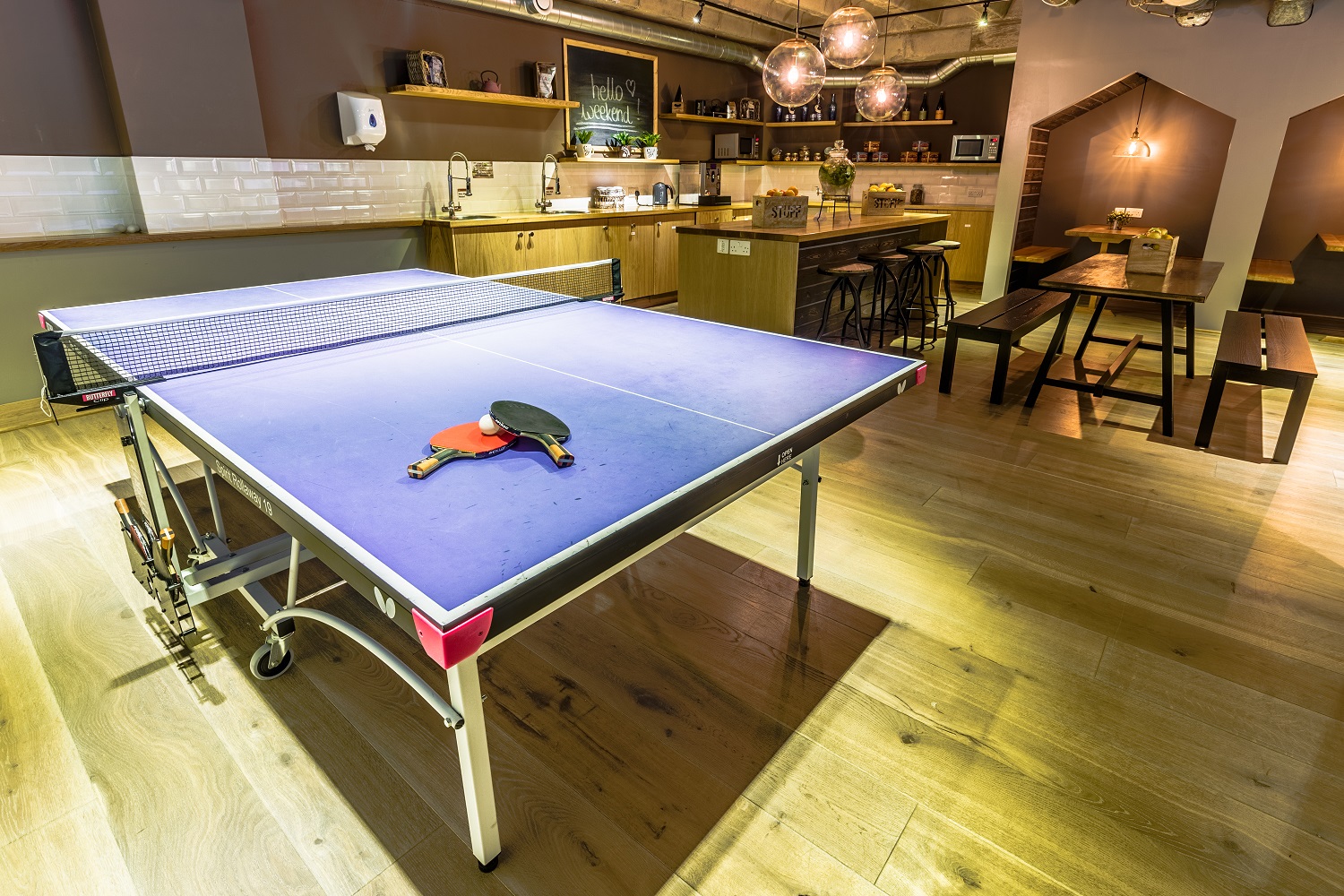 Modern venue with ping pong table, ideal for team events and networking.