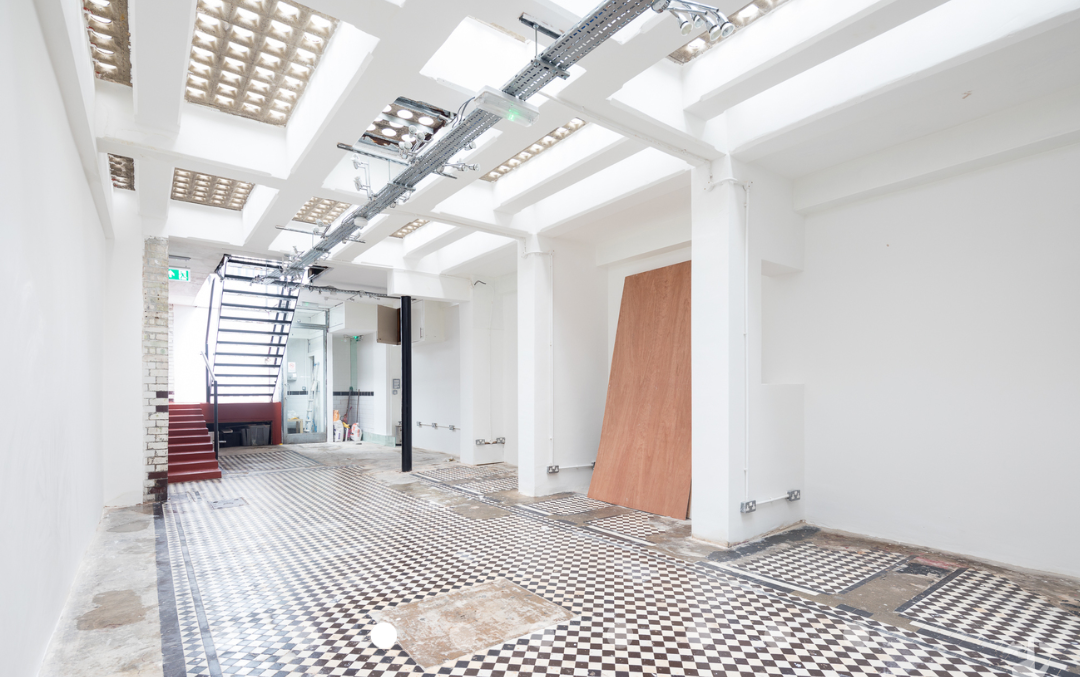 Versatile event space in Abracadabra Hub with high ceilings, ideal for workshops and networking.