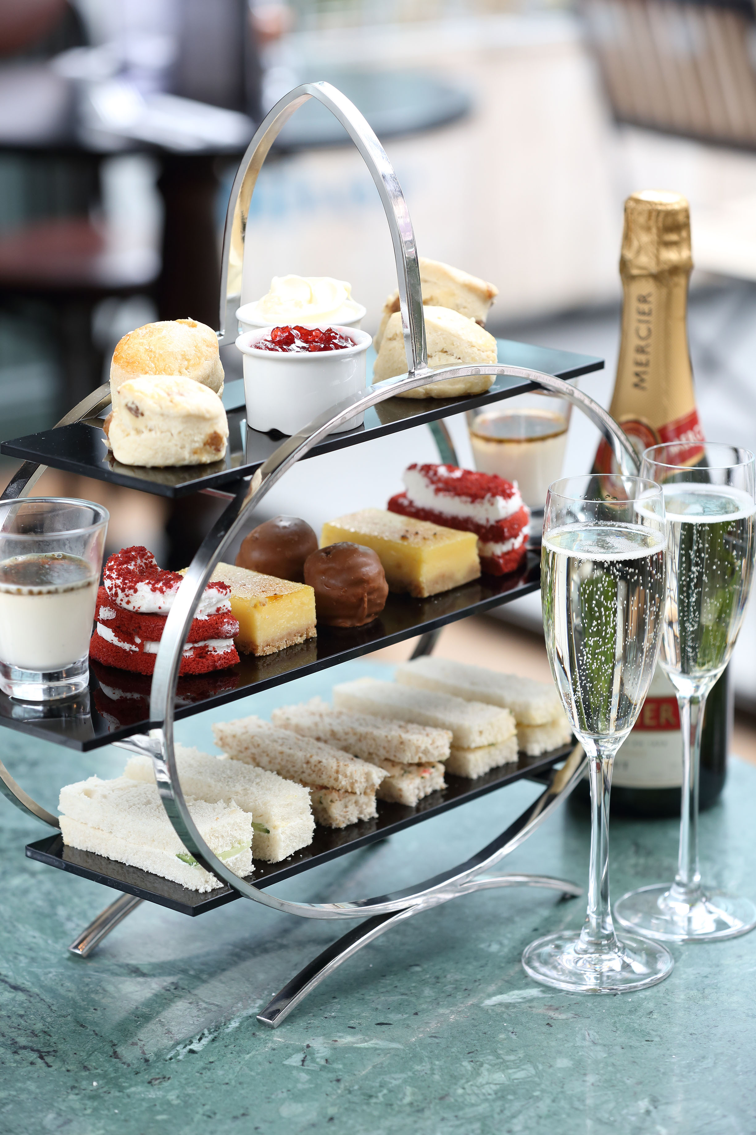 Elegant high tea setup with tiered delicacies for corporate events in Browns Mayfair.