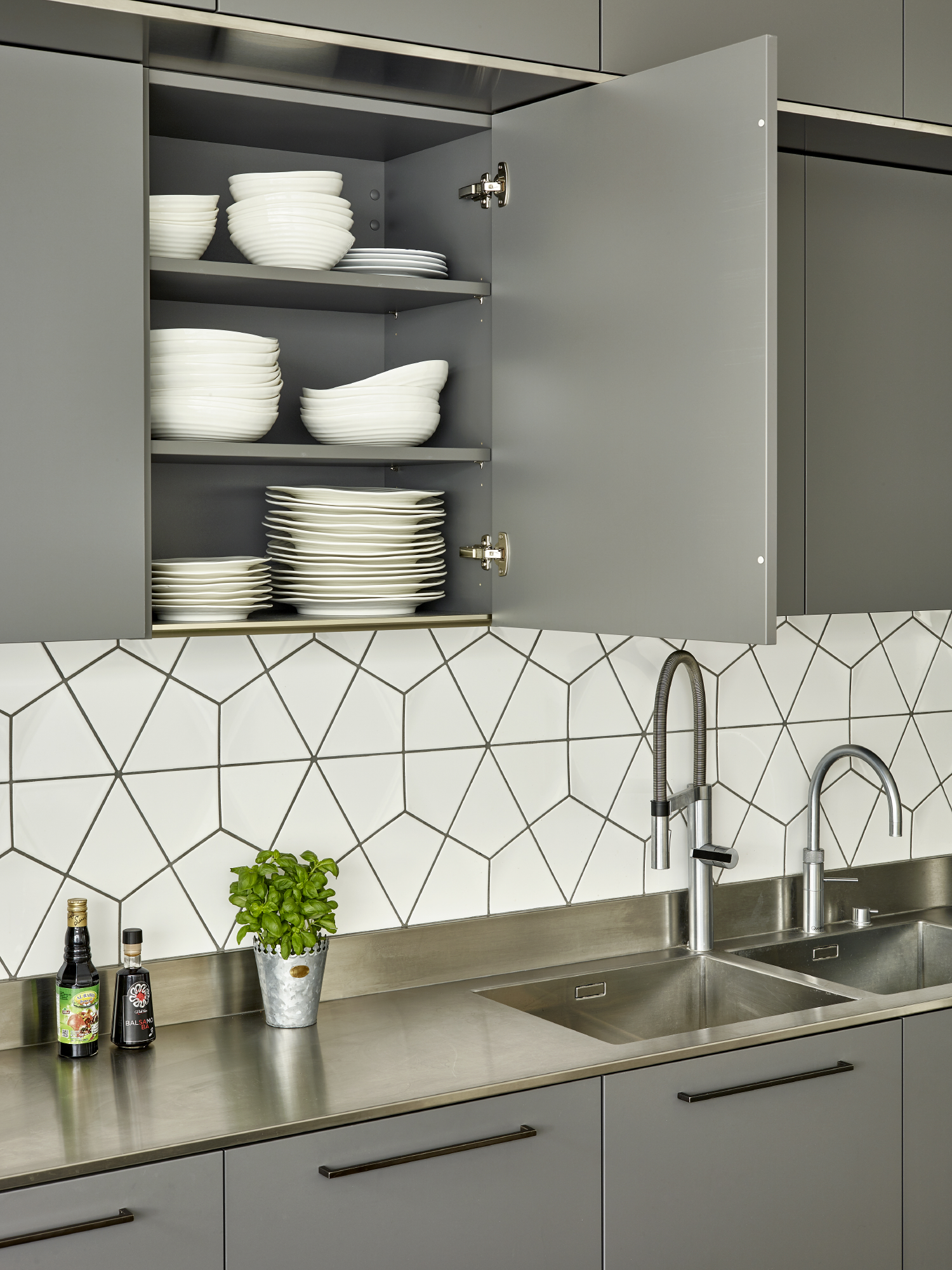 Modern kitchen and cookery school with organized space for catering events.