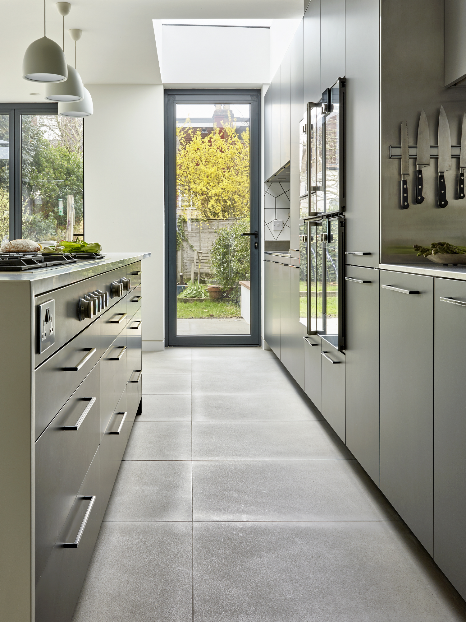 Modern kitchen with ample counter space for culinary events and cooking classes.