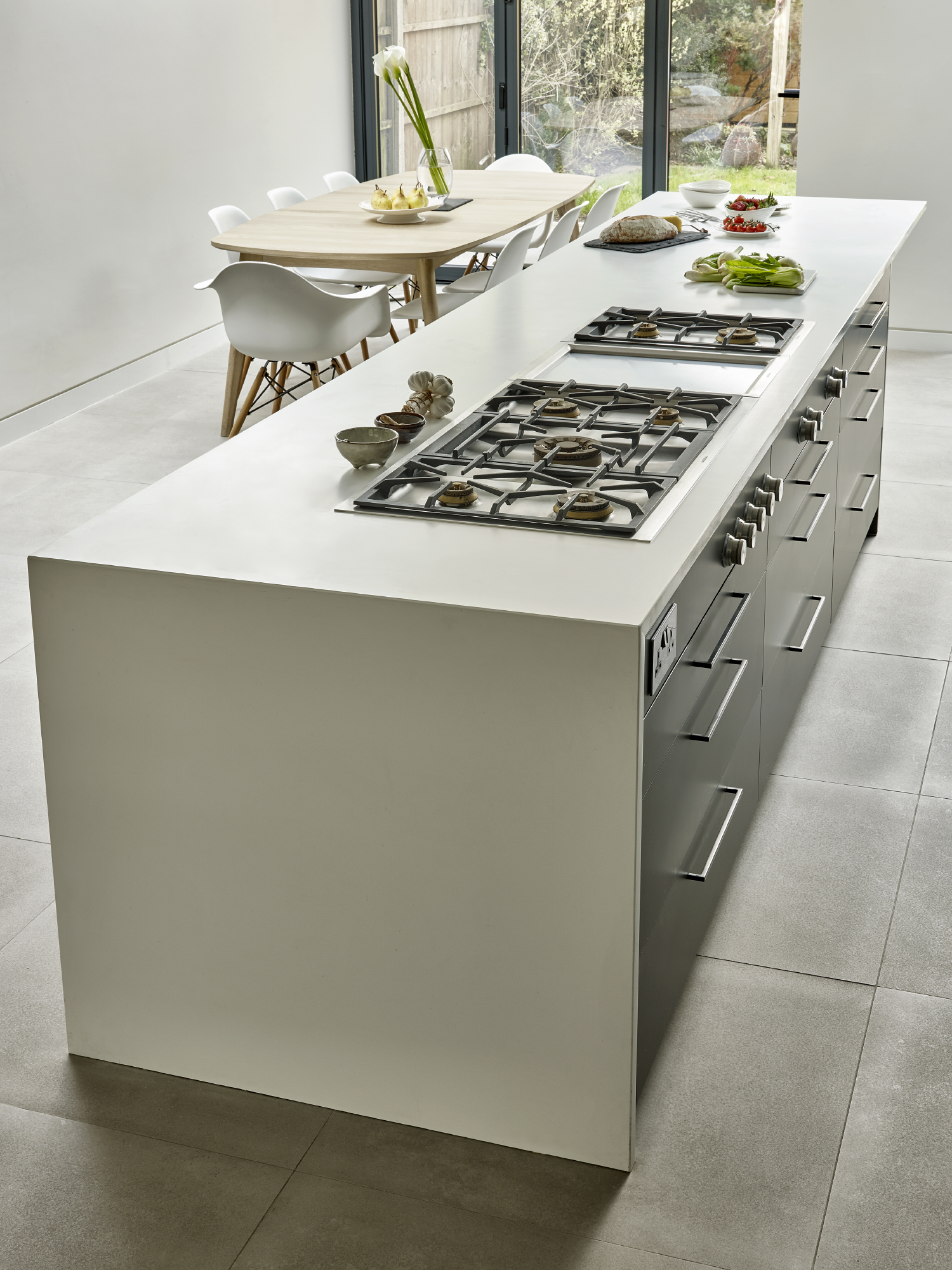 Modern kitchen island with gas cooktop for culinary events and cooking demonstrations.