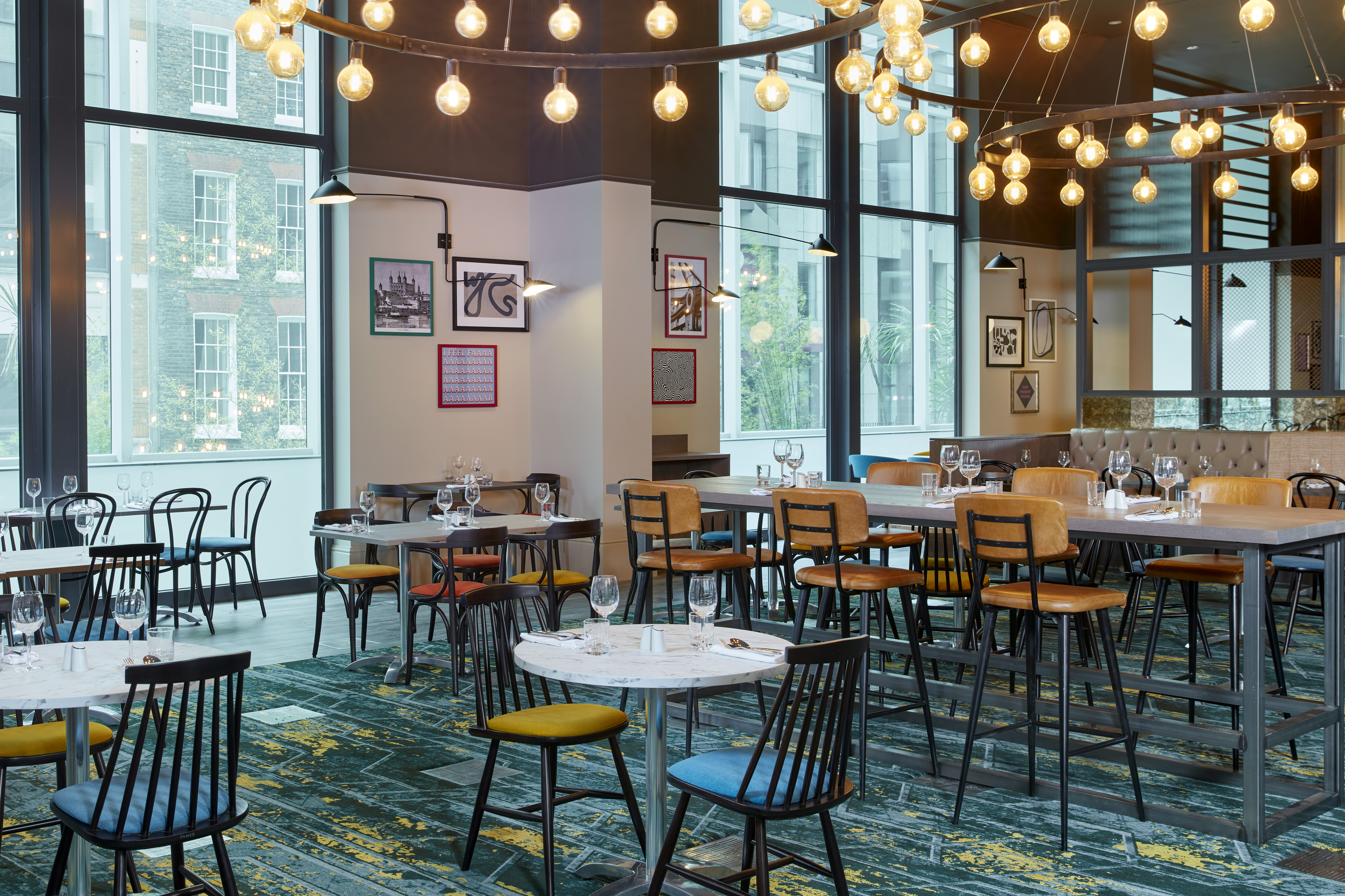 Modern dining space in Leonardo Royal Hotel London, ideal for events and meetings.