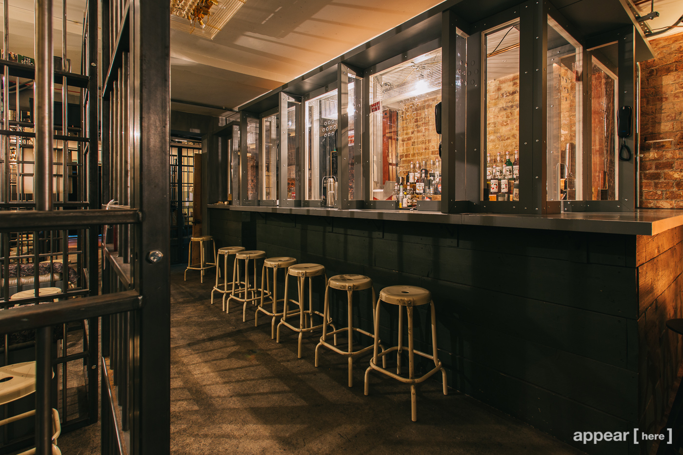 Alcotraz Prison Cocktail Bar with vintage decor, ideal for themed events and gatherings.