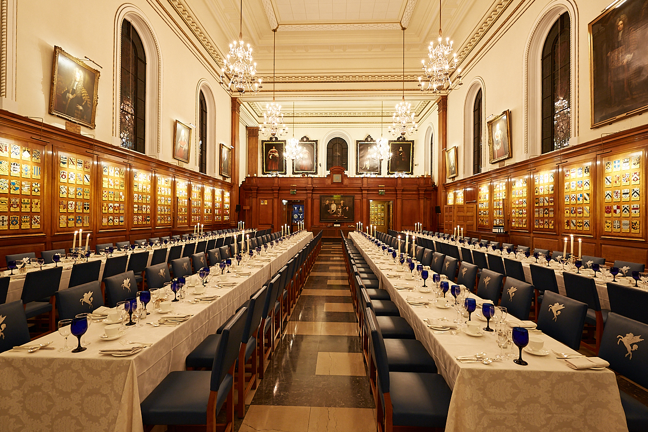 Elegant Inner Temple Hall banquet setup with blue glassware for formal events.