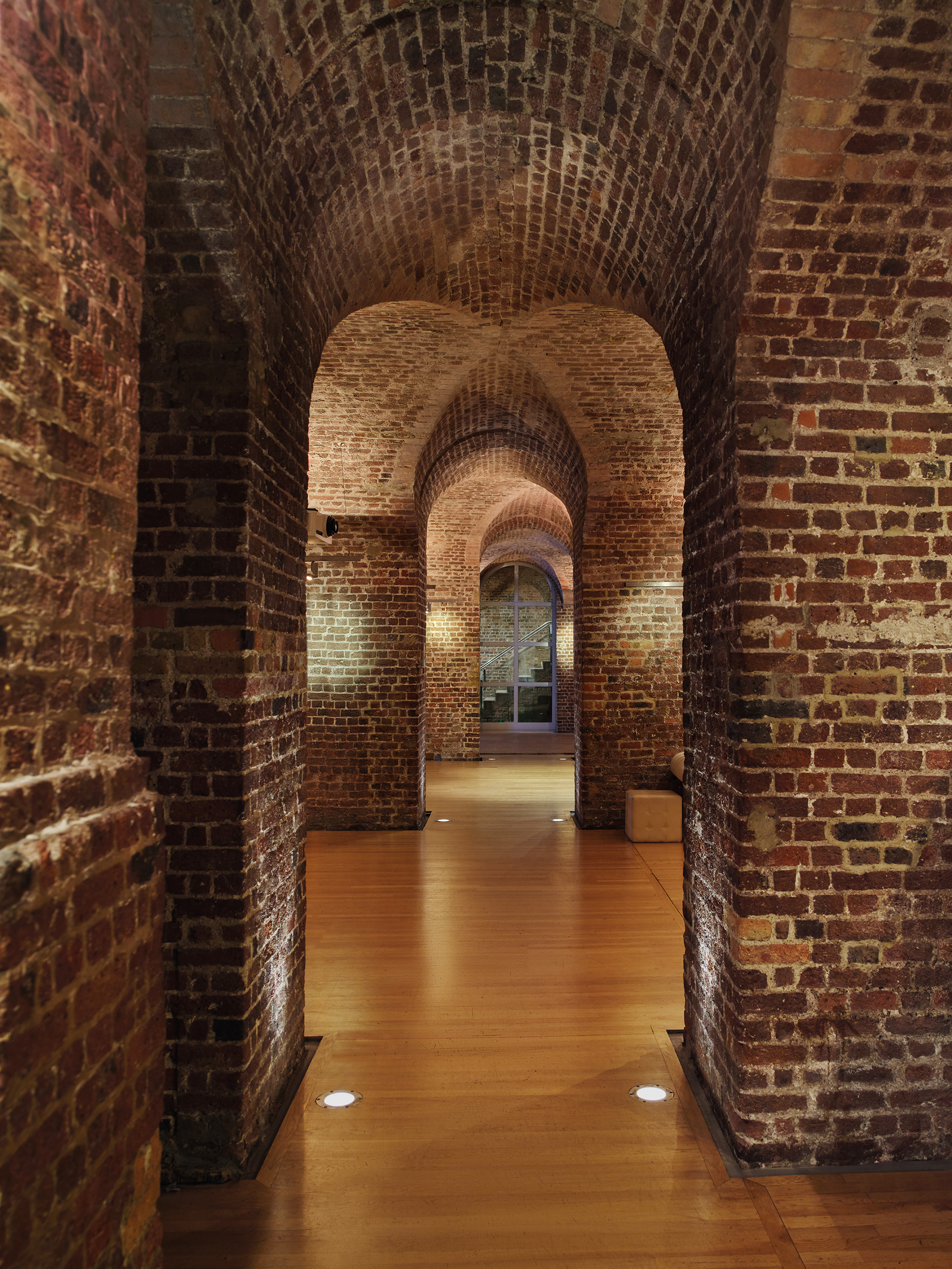 Christmas party venue with exposed brick arches at RSA House, perfect for events.