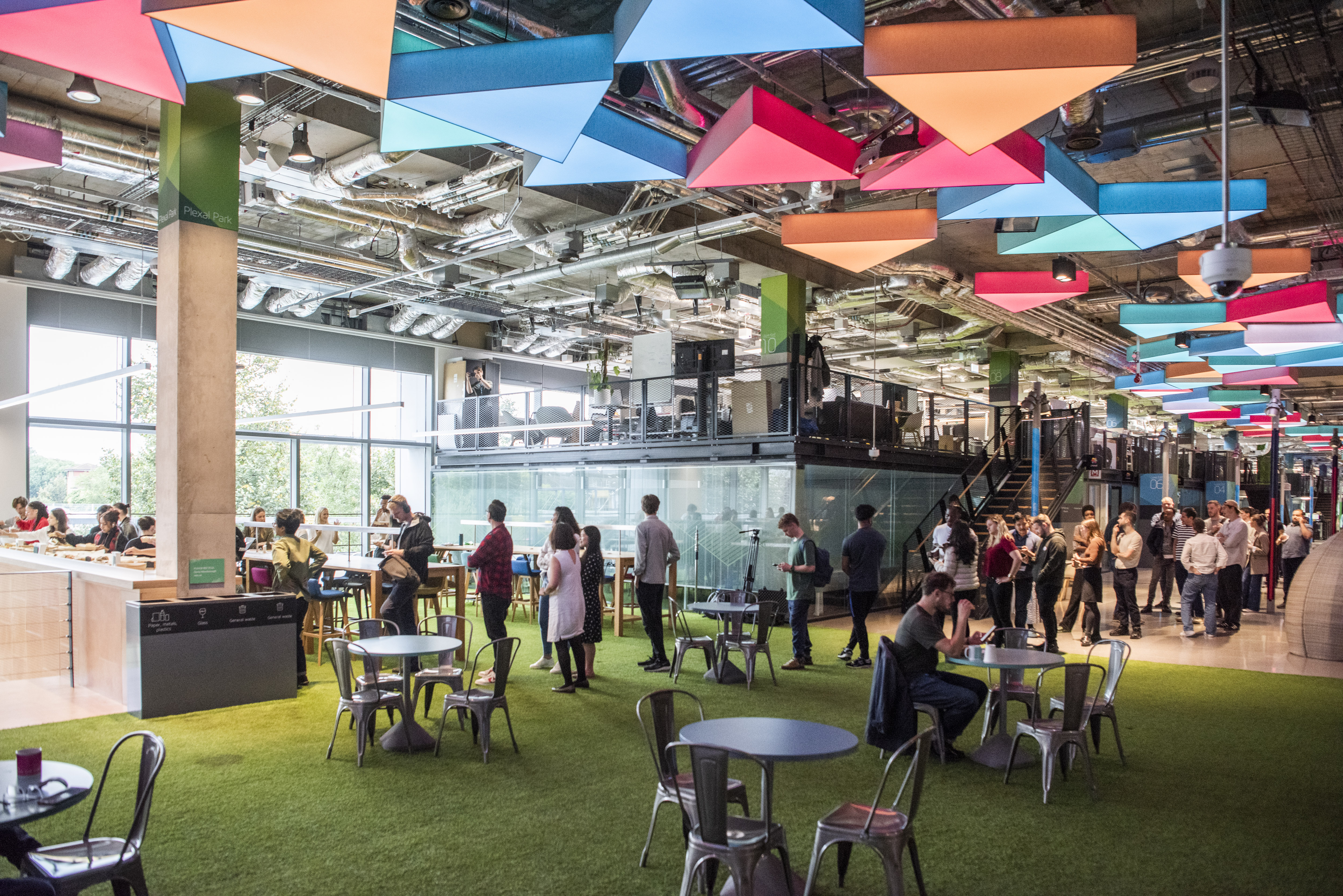 Vibrant CENTRE STAGE event space with colorful decor for networking and collaboration.