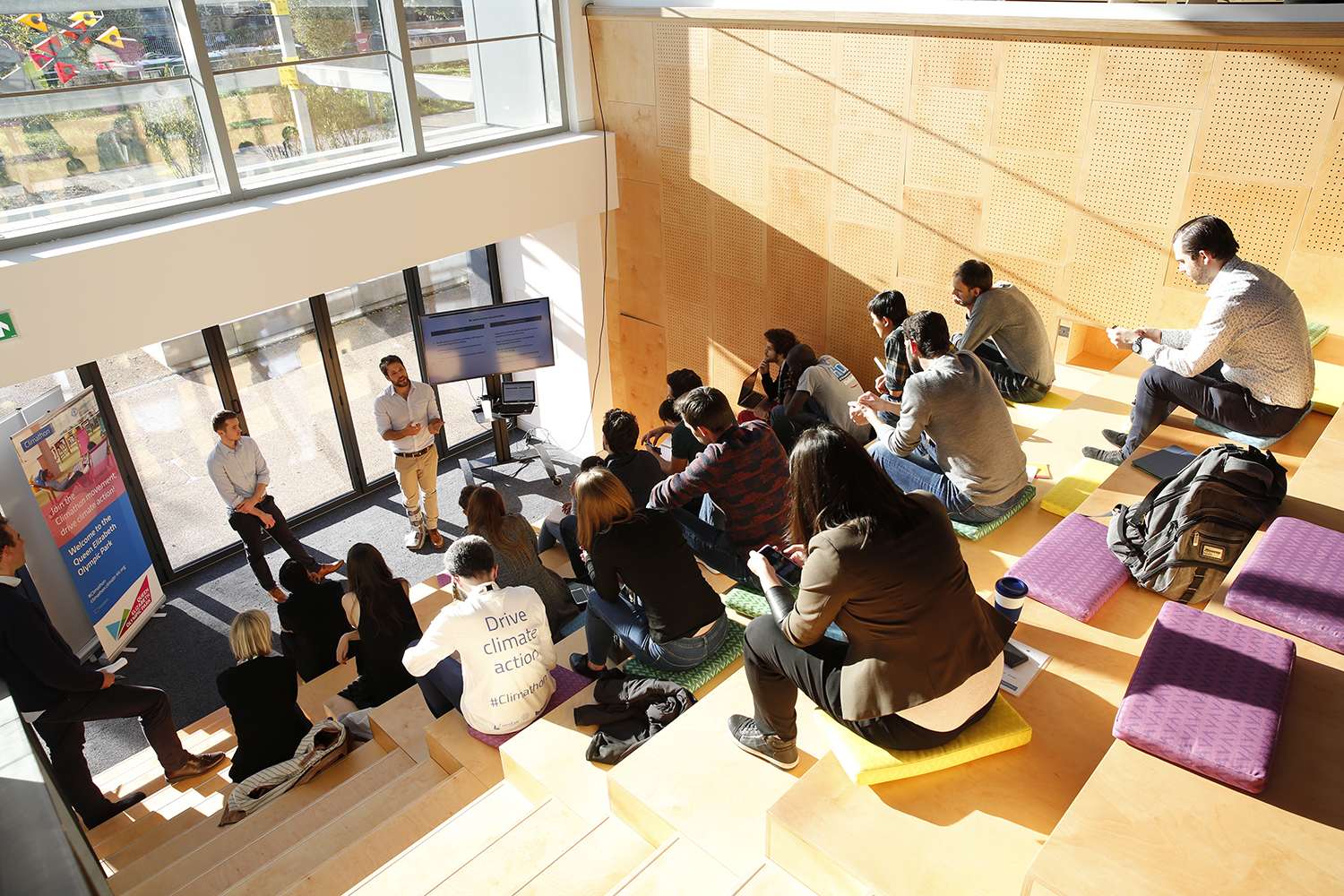 Dynamic meeting space with tiered seating for workshops and brainstorming sessions.