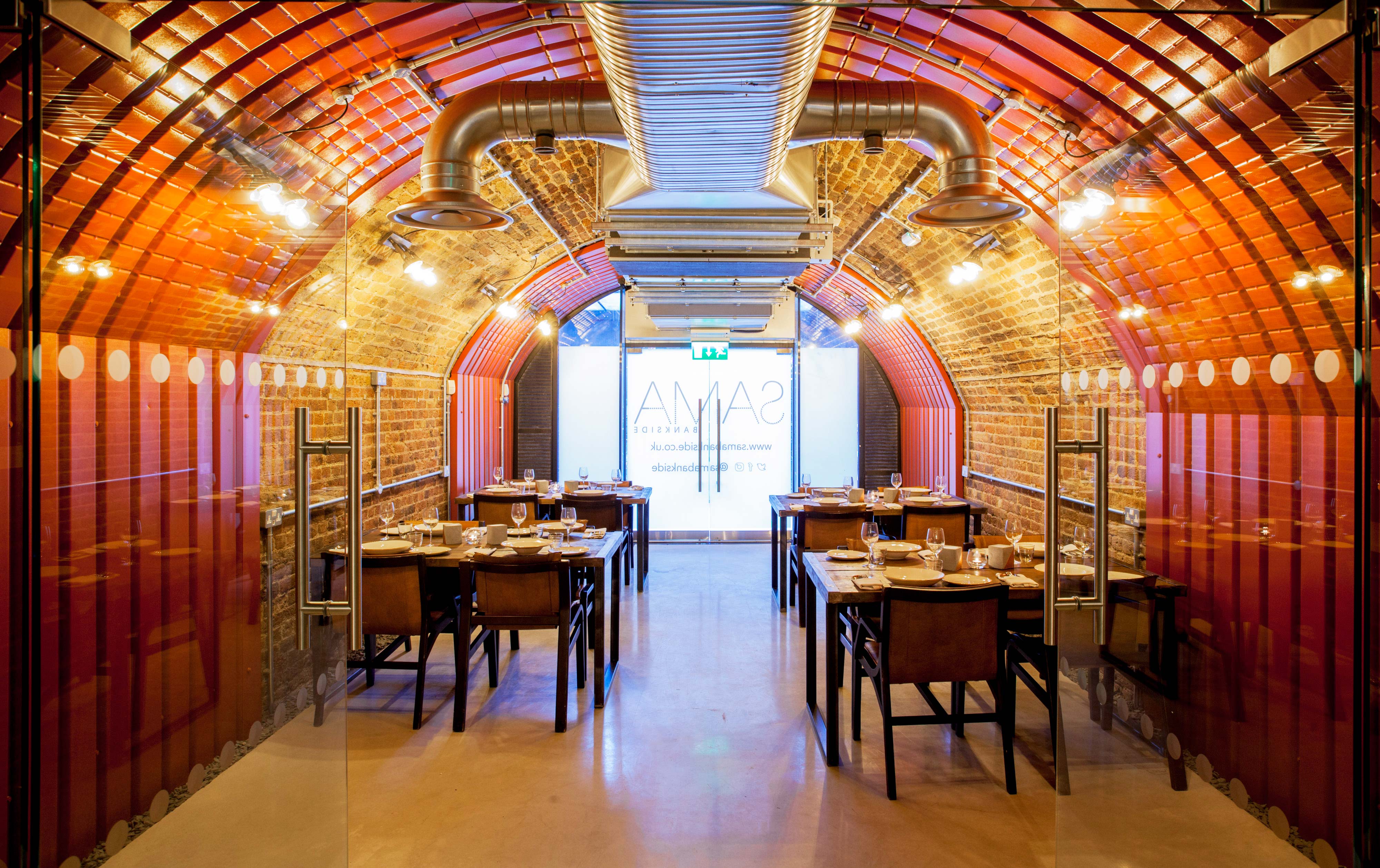 Private Room at SAMA Bankside with arched brick interior for stylish corporate events.