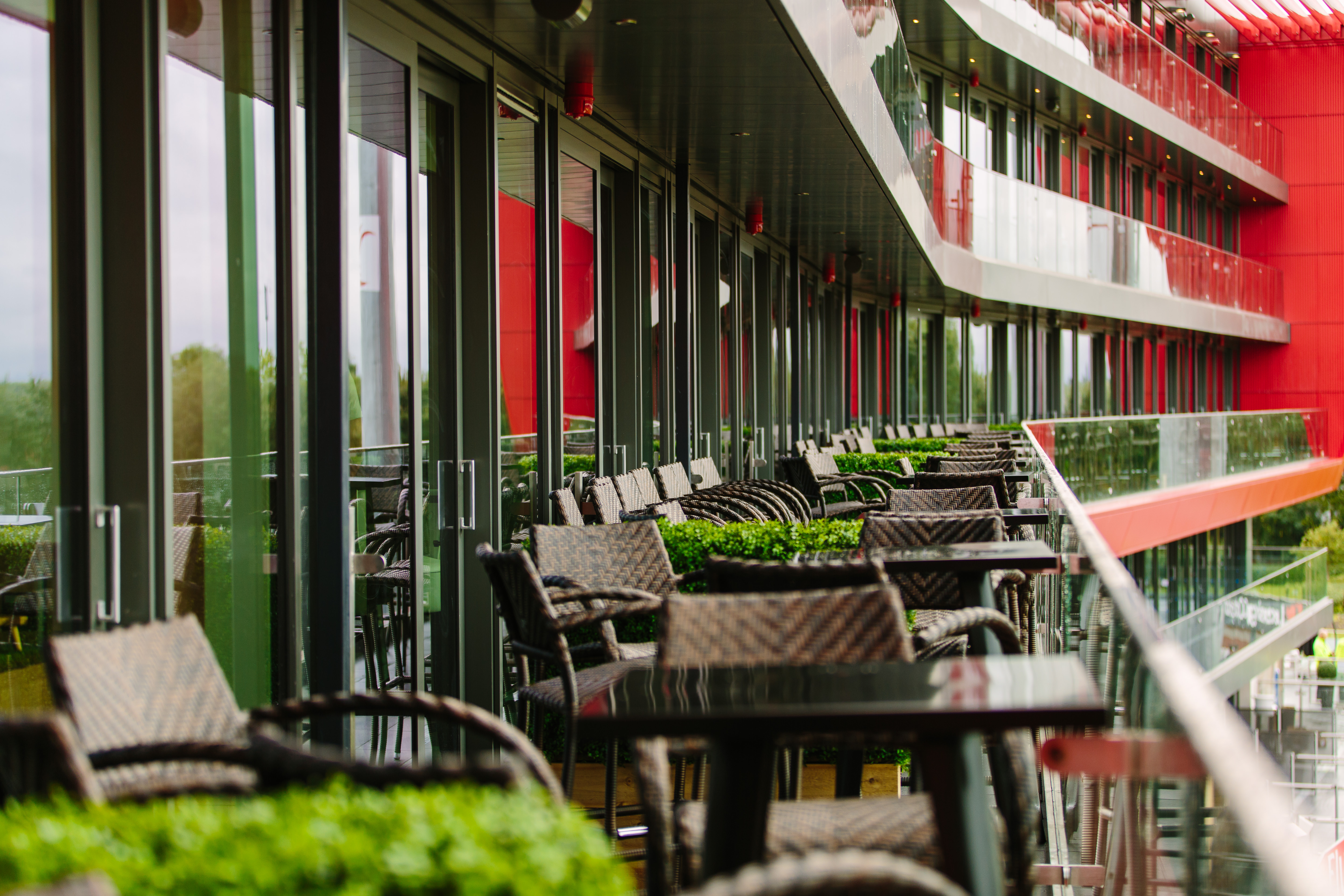 Modern outdoor terrace at Hilton Garden Inn Manchester, ideal for networking events.