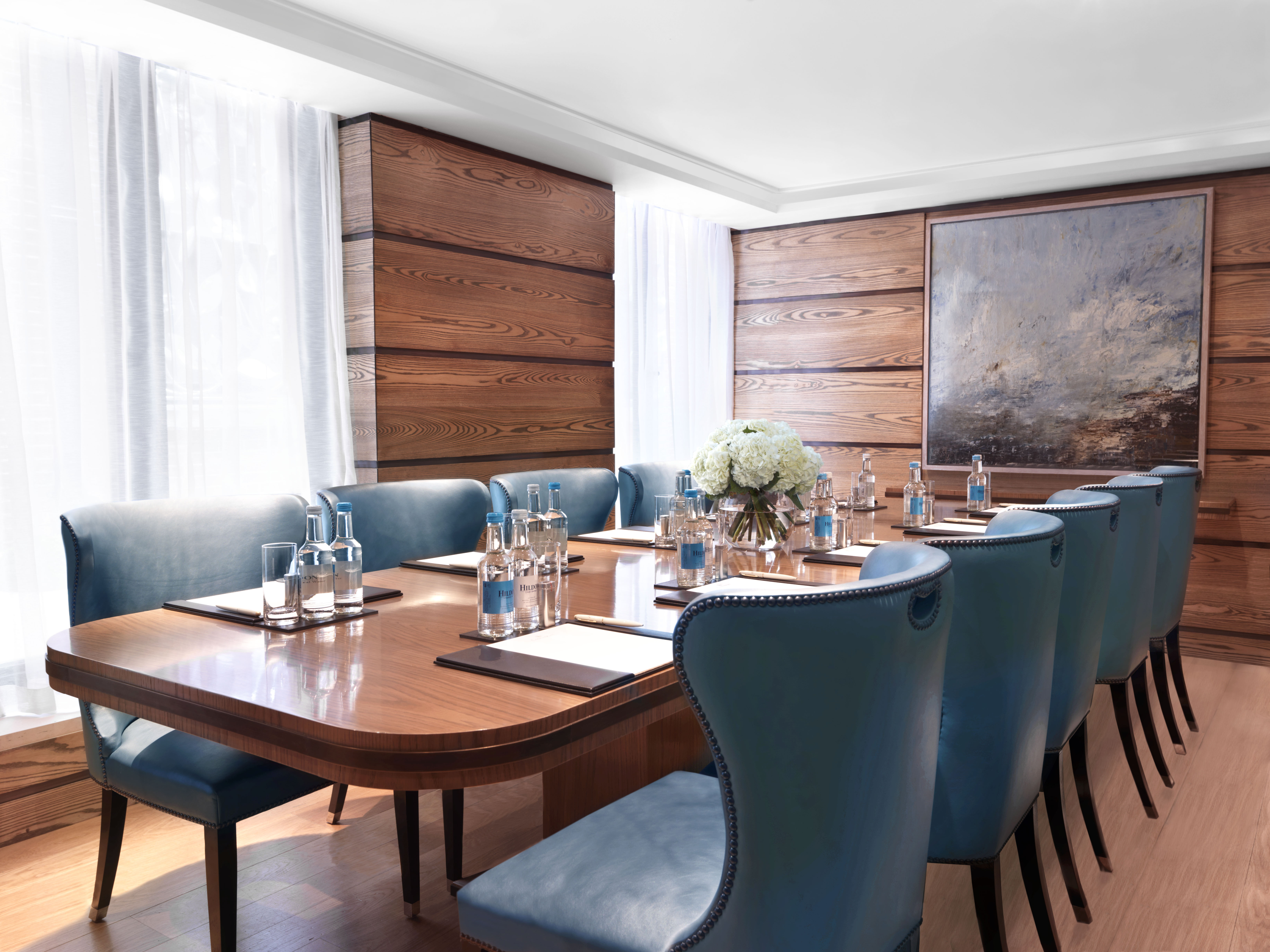 Sophisticated meeting room with elegant wood paneling at The Connaught for corporate events.