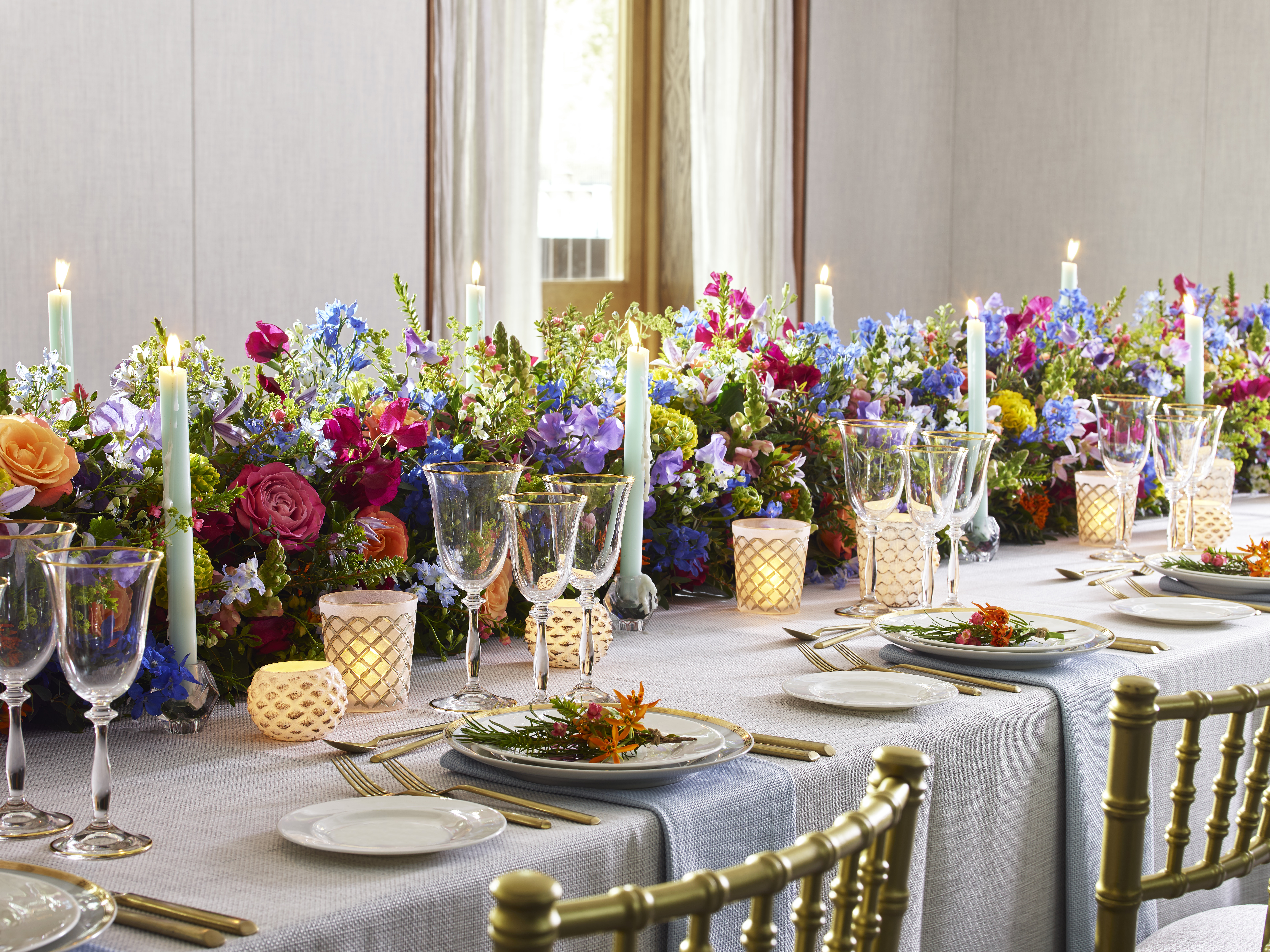 Elegant banquet table with floral centerpieces for weddings and corporate events.