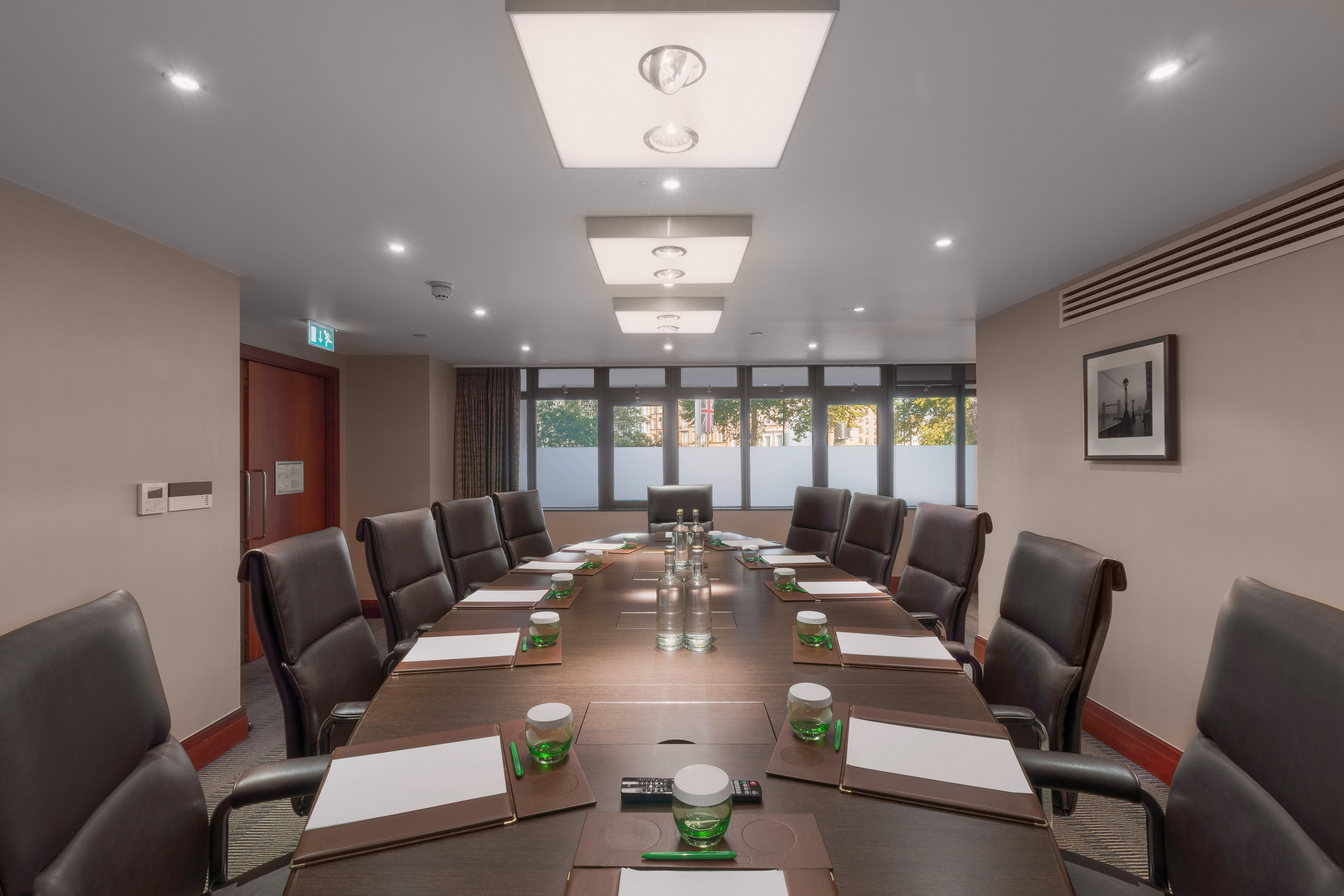 Executive Boardroom at Holiday Inn Kensington, featuring a polished table for corporate meetings.