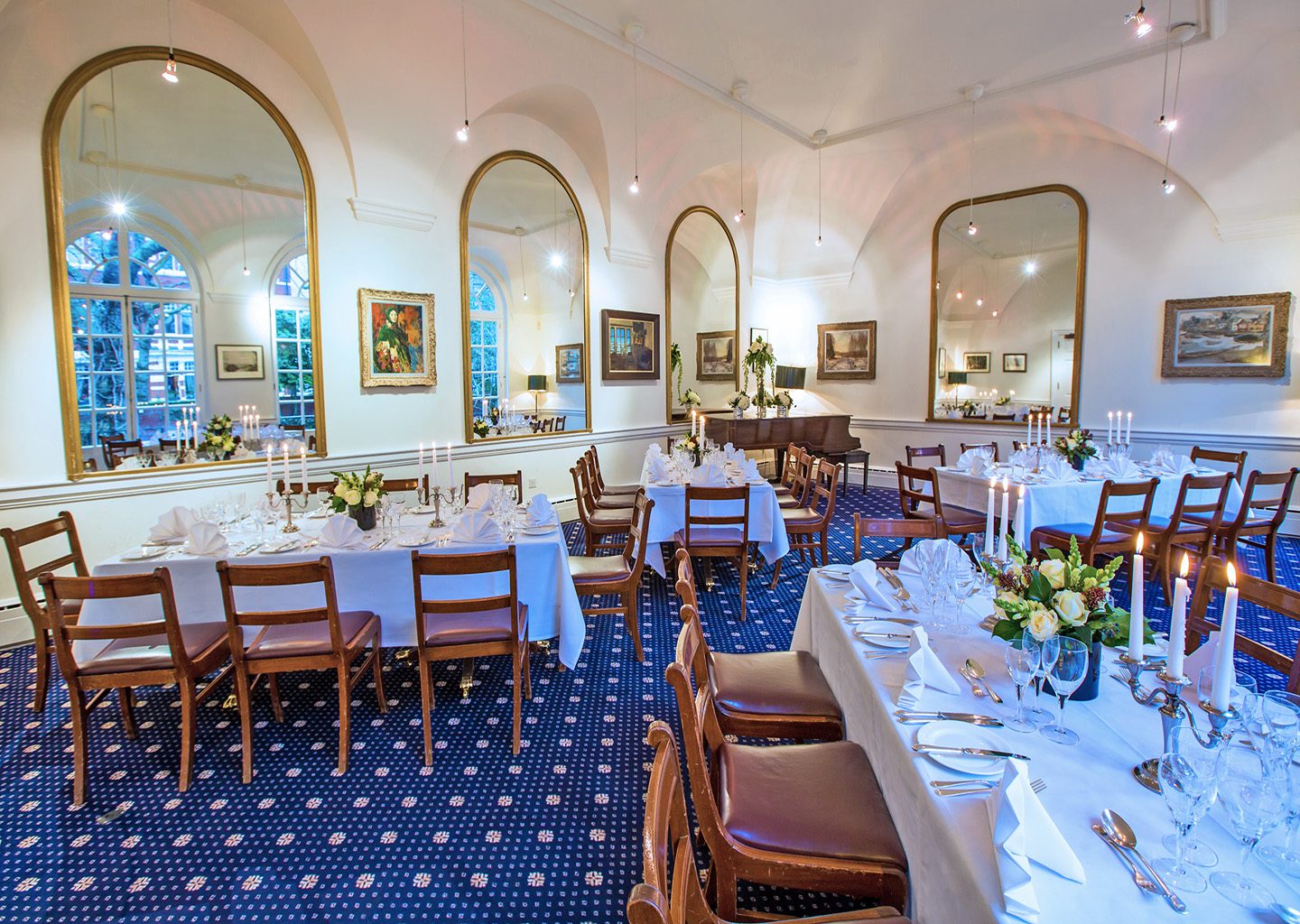 Elegant dining room with floral centerpieces for upscale events at Imperial Venues.
