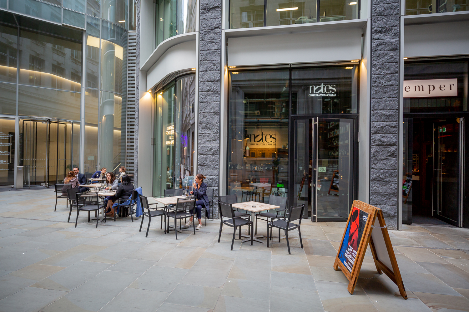 Vibrant outdoor dining area at Notes Bank, perfect for casual meetings and networking events.