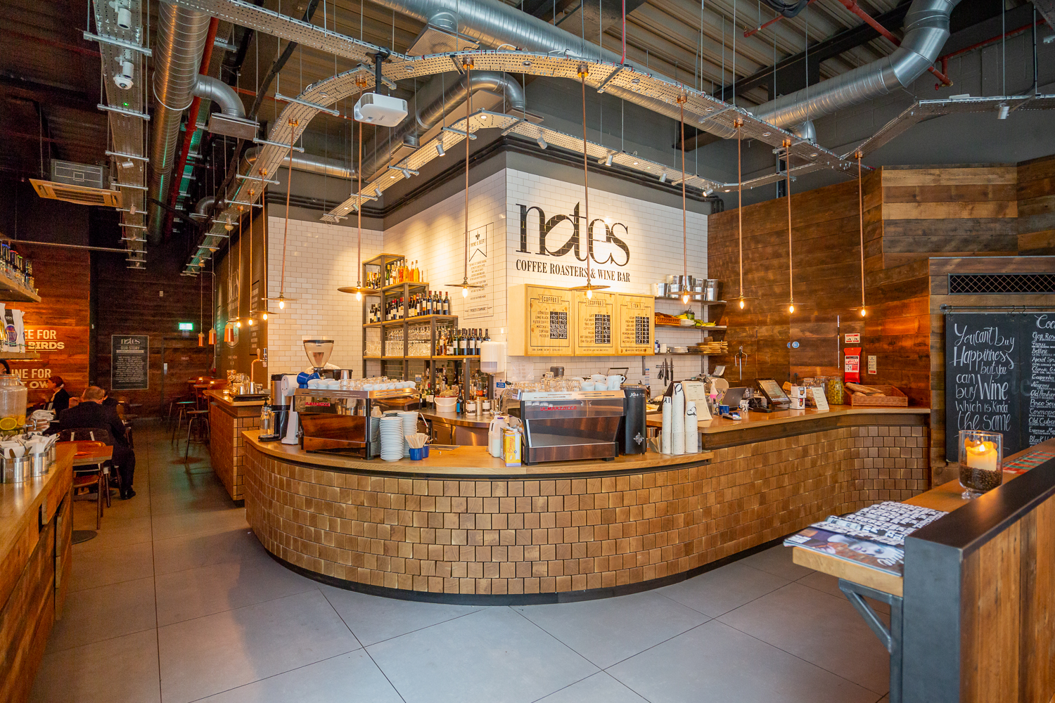 Modern café venue with wooden accents, ideal for networking events and meetings.