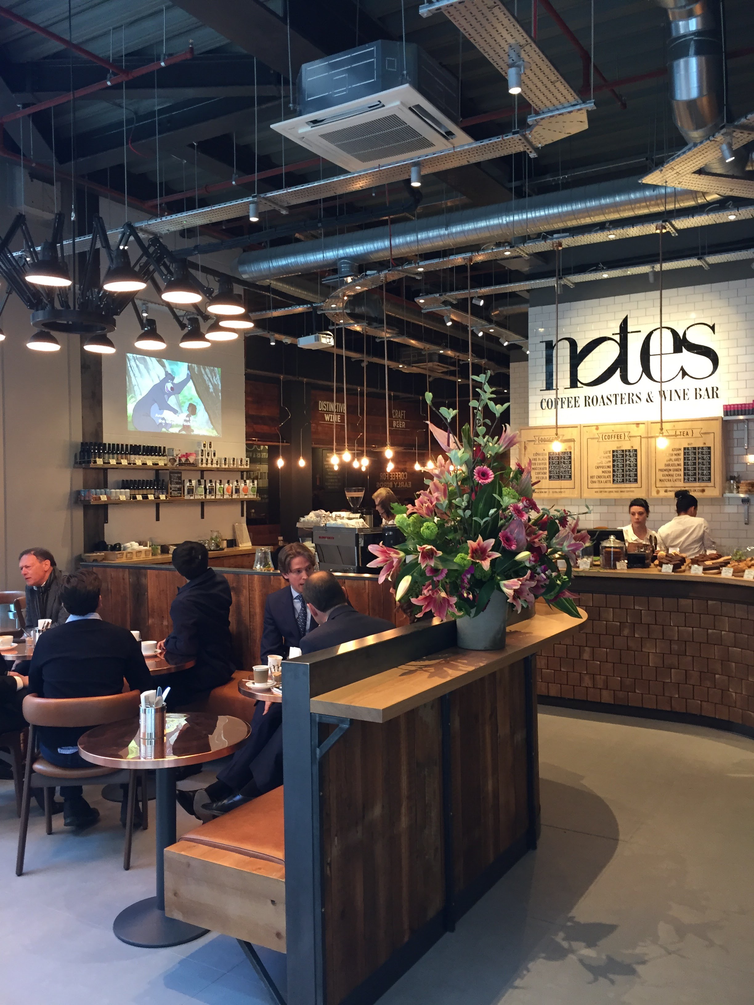 Modern café venue with cozy seating, ideal for networking and informal meetings.