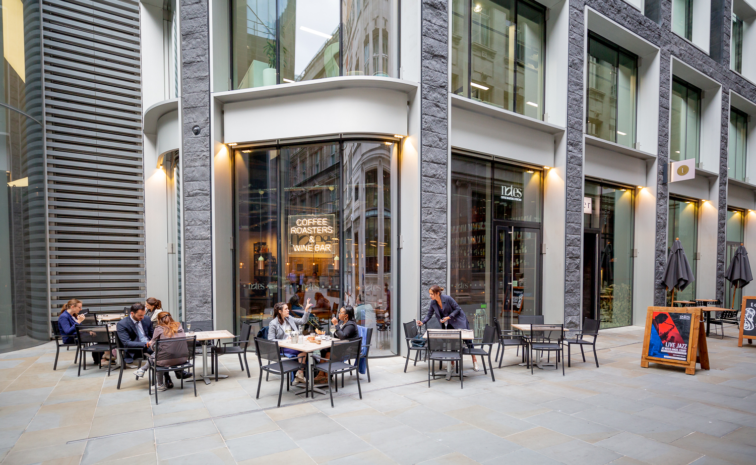 Vibrant outdoor café in Notes Bank, ideal for networking and informal meetings.
