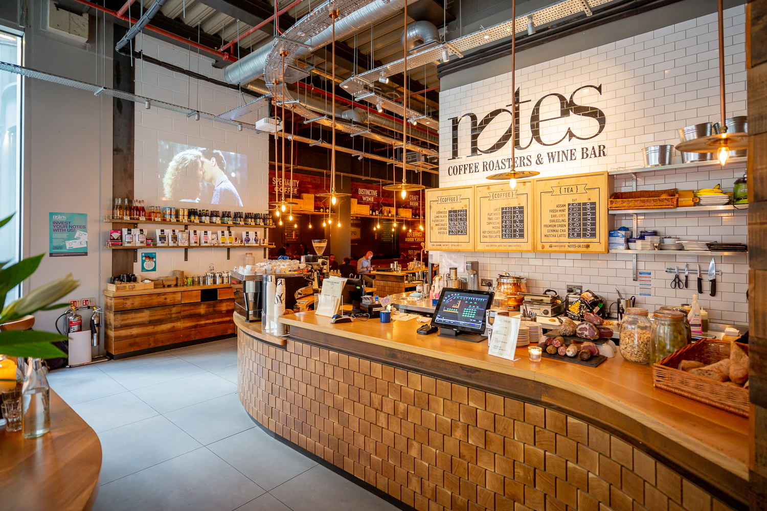 Stylish coffee roastery and wine bar venue for networking events in warm, inviting decor.