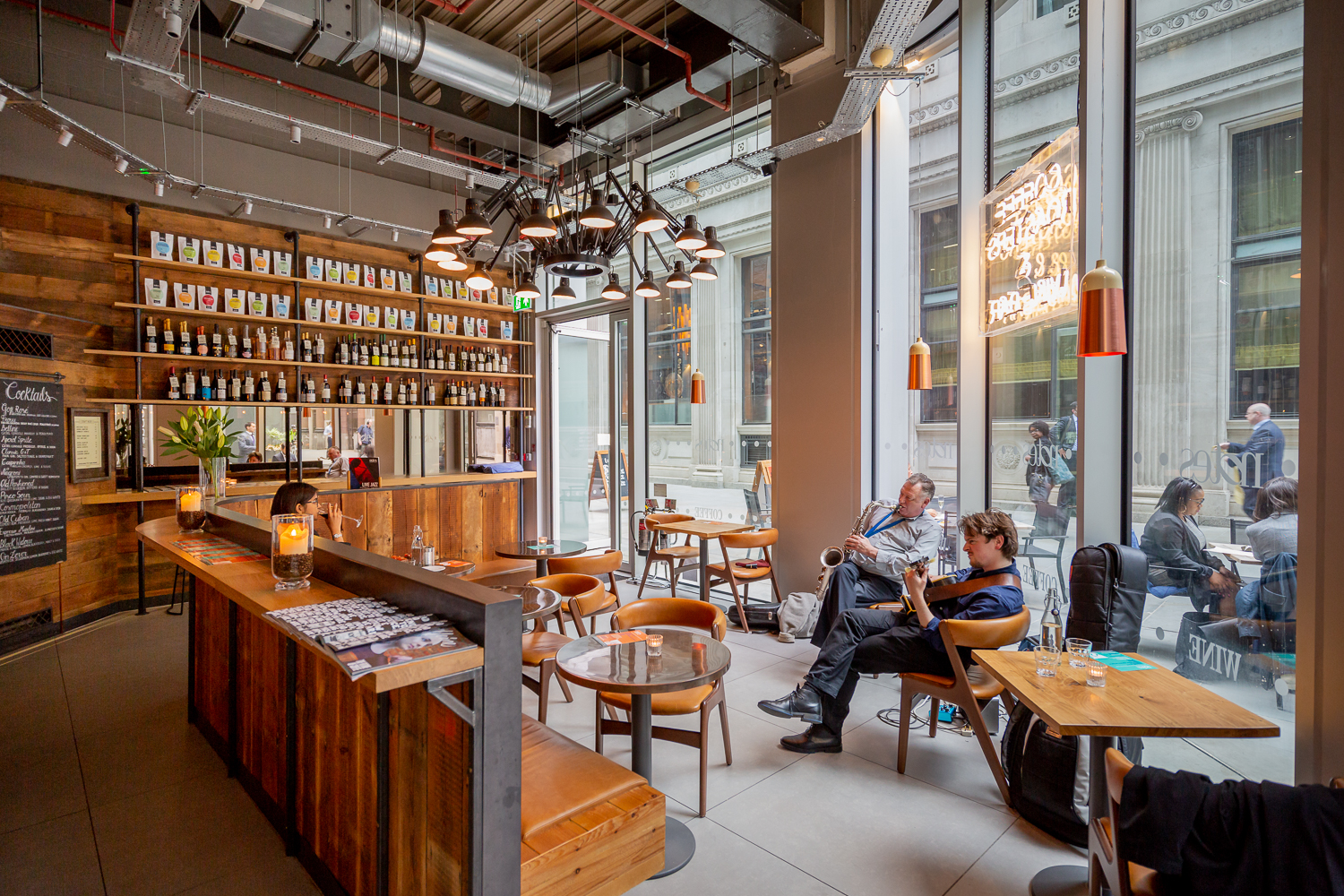 Modern café venue with warm wood accents, ideal for networking events and meetings.