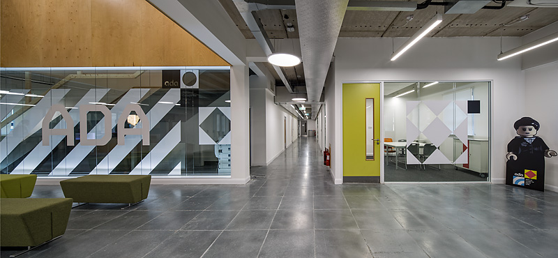 Modern meeting room with glass walls at Ada National College for Digital Skills, ideal for events.