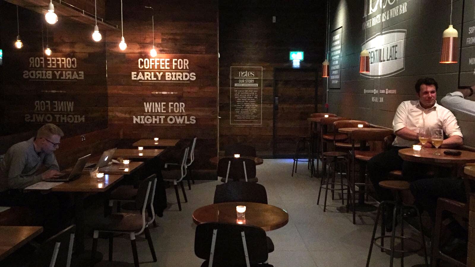 Cozy Back Space venue with warm lighting for informal meetings and networking events.