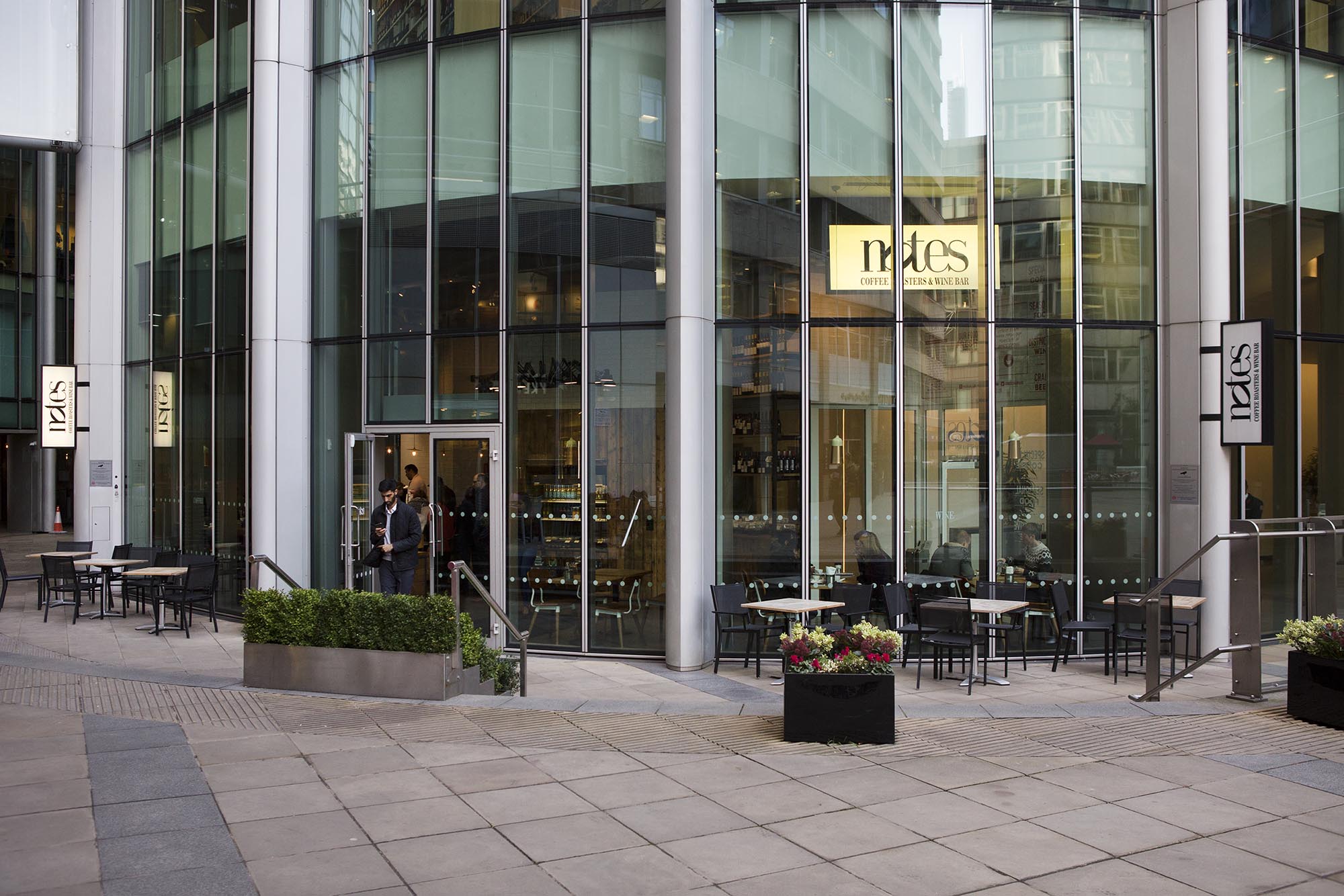 Modern venue with large glass windows, ideal for corporate meetings and events.