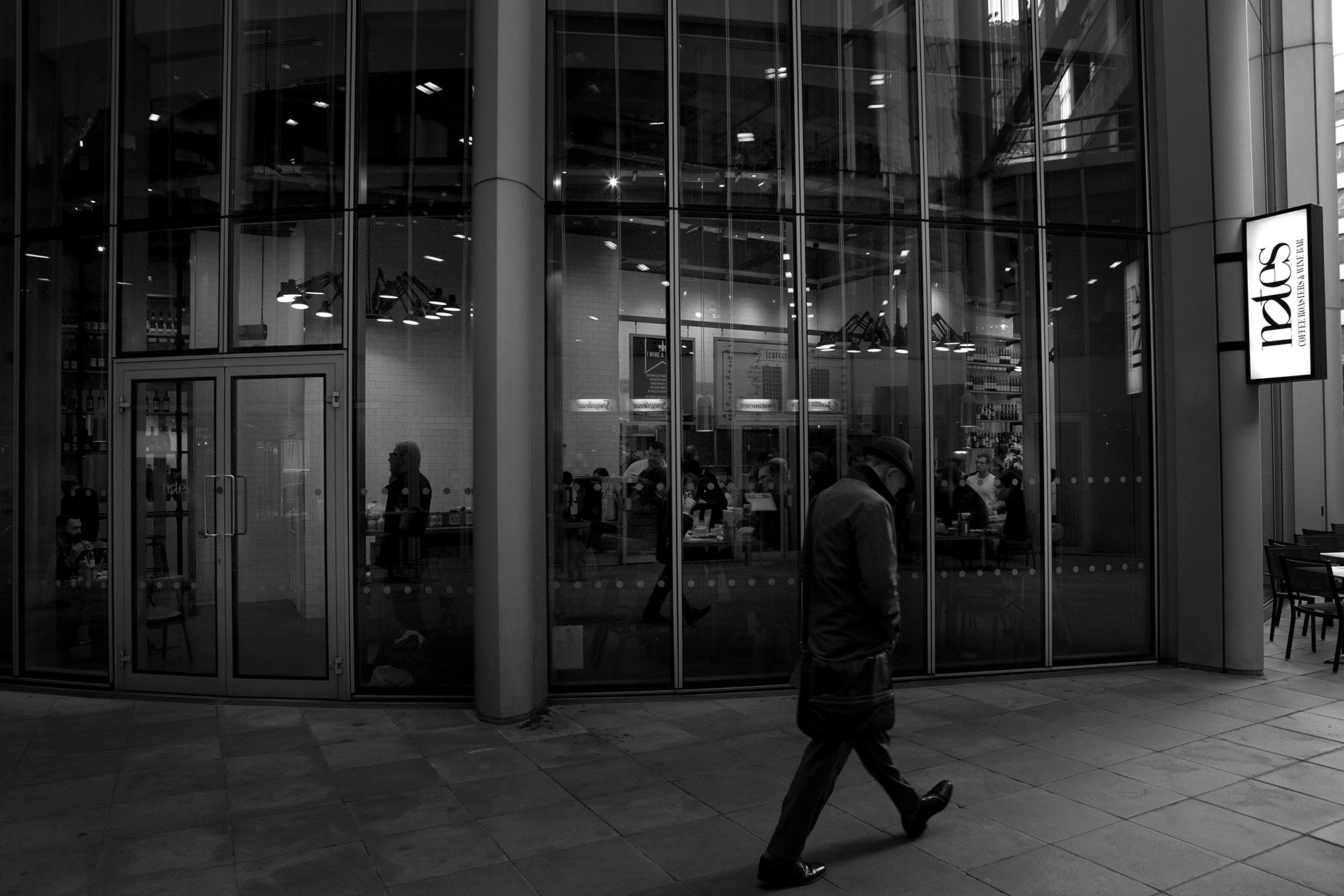 Modern event venue with large glass windows, ideal for corporate functions and social gatherings.