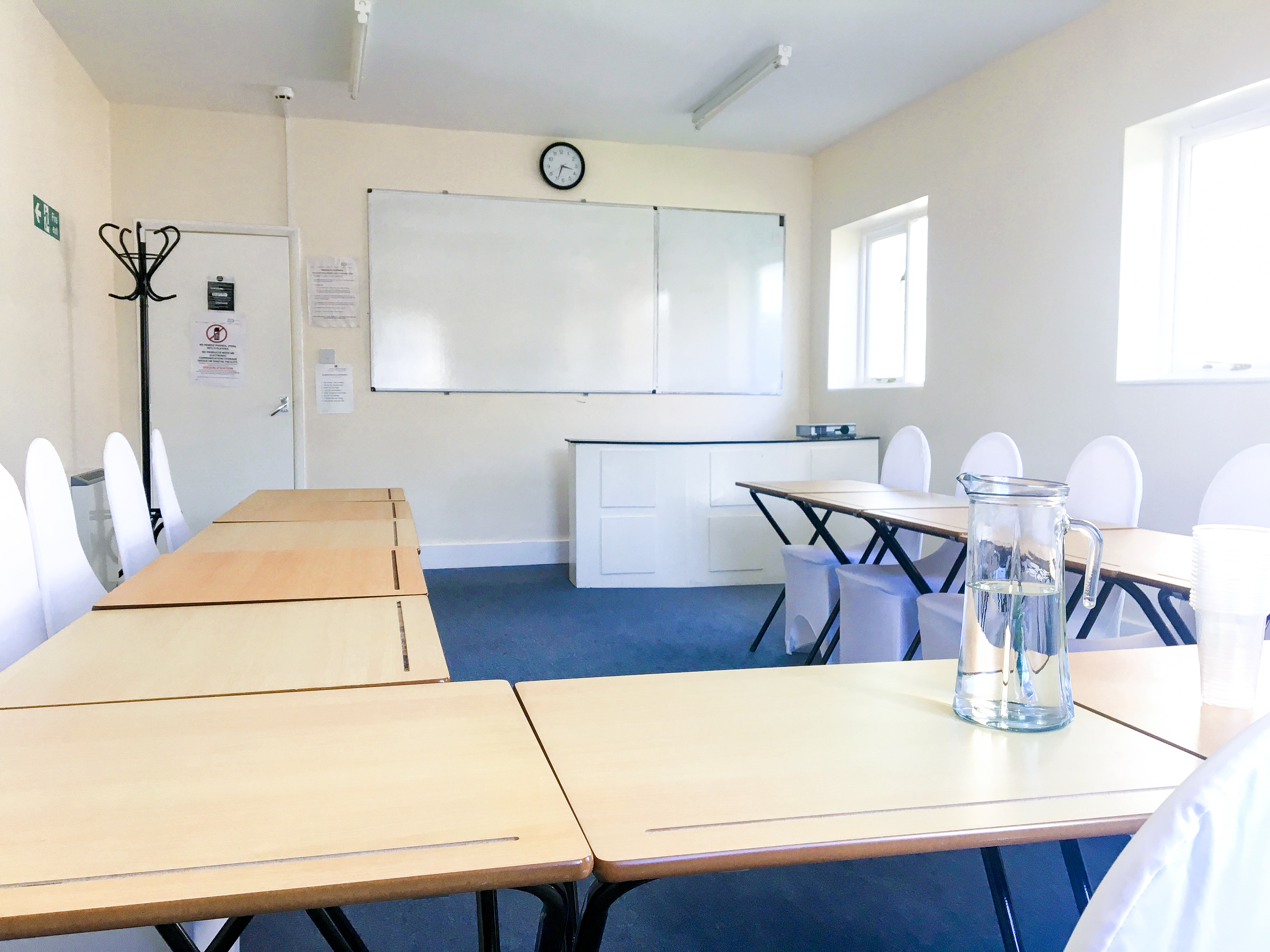Meeting Room 101 at North London College, ideal for workshops with organized seating and whiteboard.
