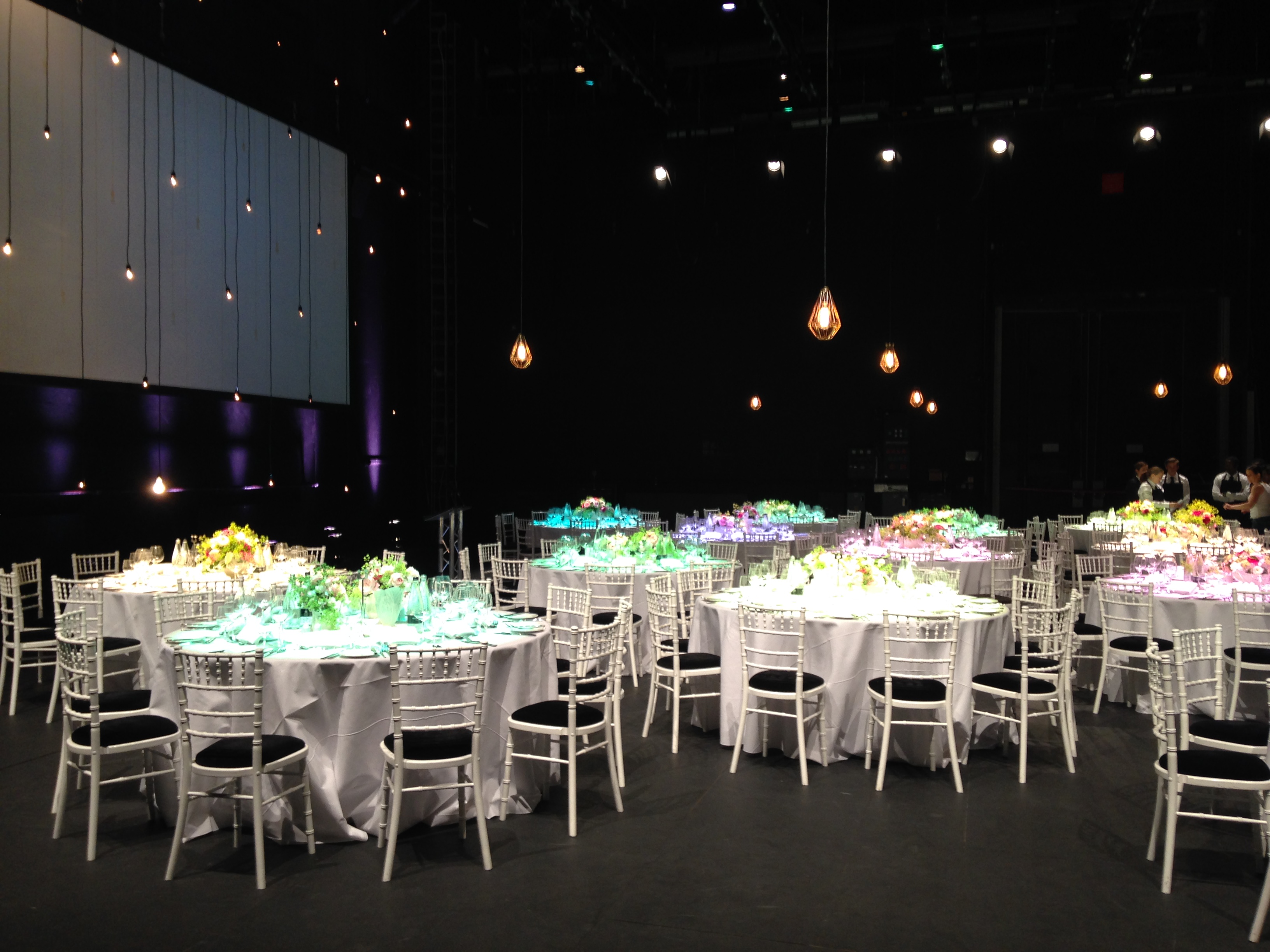 Sadler's Wells Theatre event space with elegant tables, floral centerpieces for weddings.