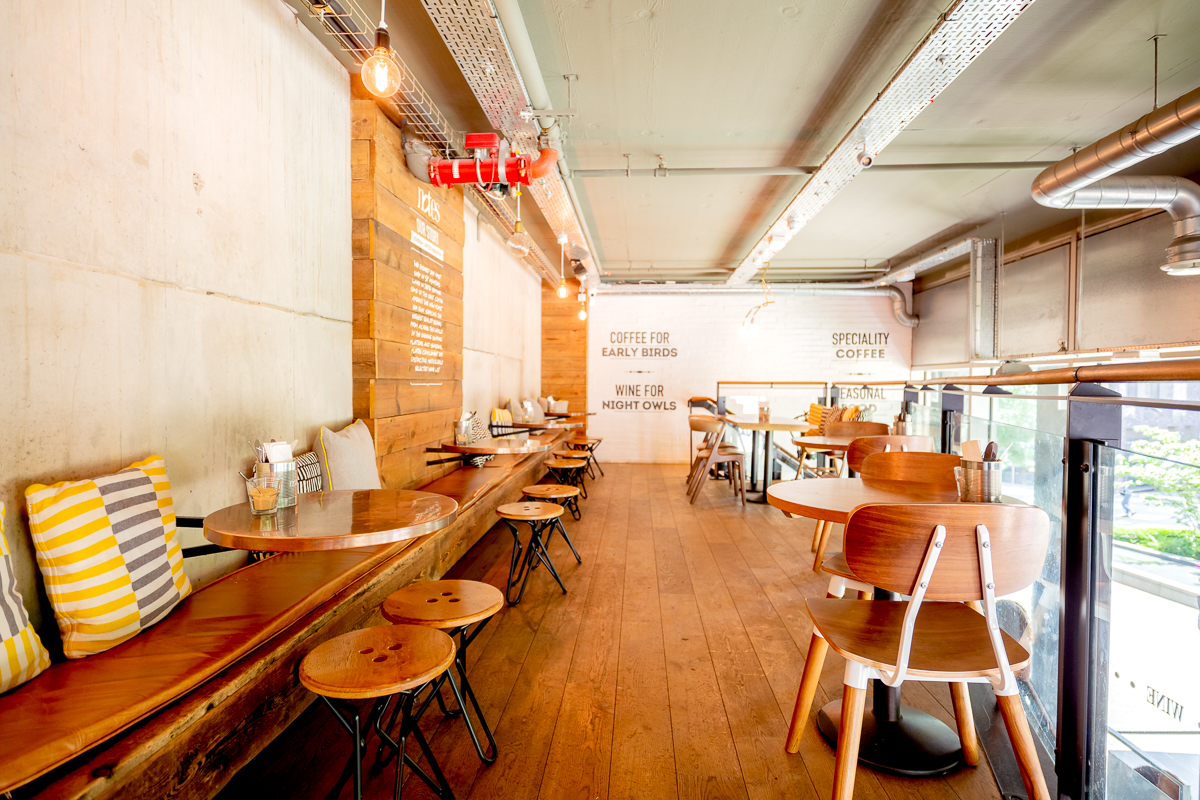 Modern venue with warm wood tones, perfect for networking and meetings.