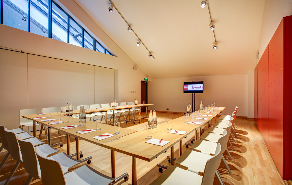 Modern meeting room at Sadler's Wells with large table, ideal for corporate workshops.