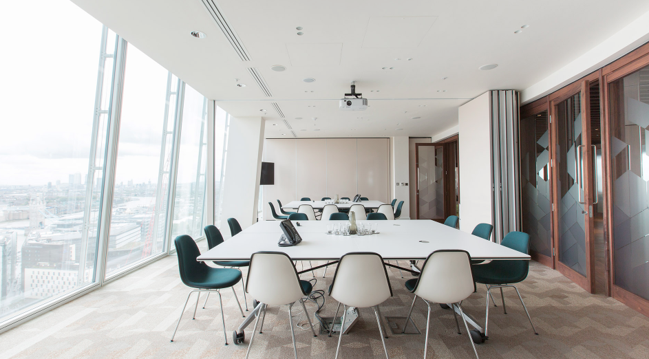 Modern meeting room in The Shard with large windows for corporate gatherings.