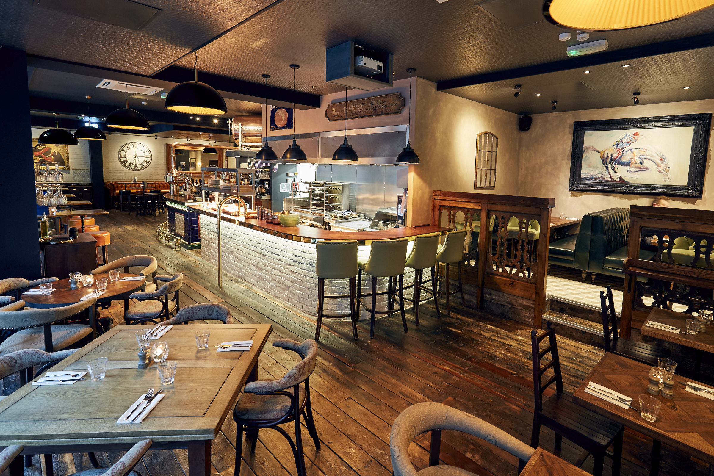 Stylish restaurant dining room with warm lighting for intimate gatherings and events.