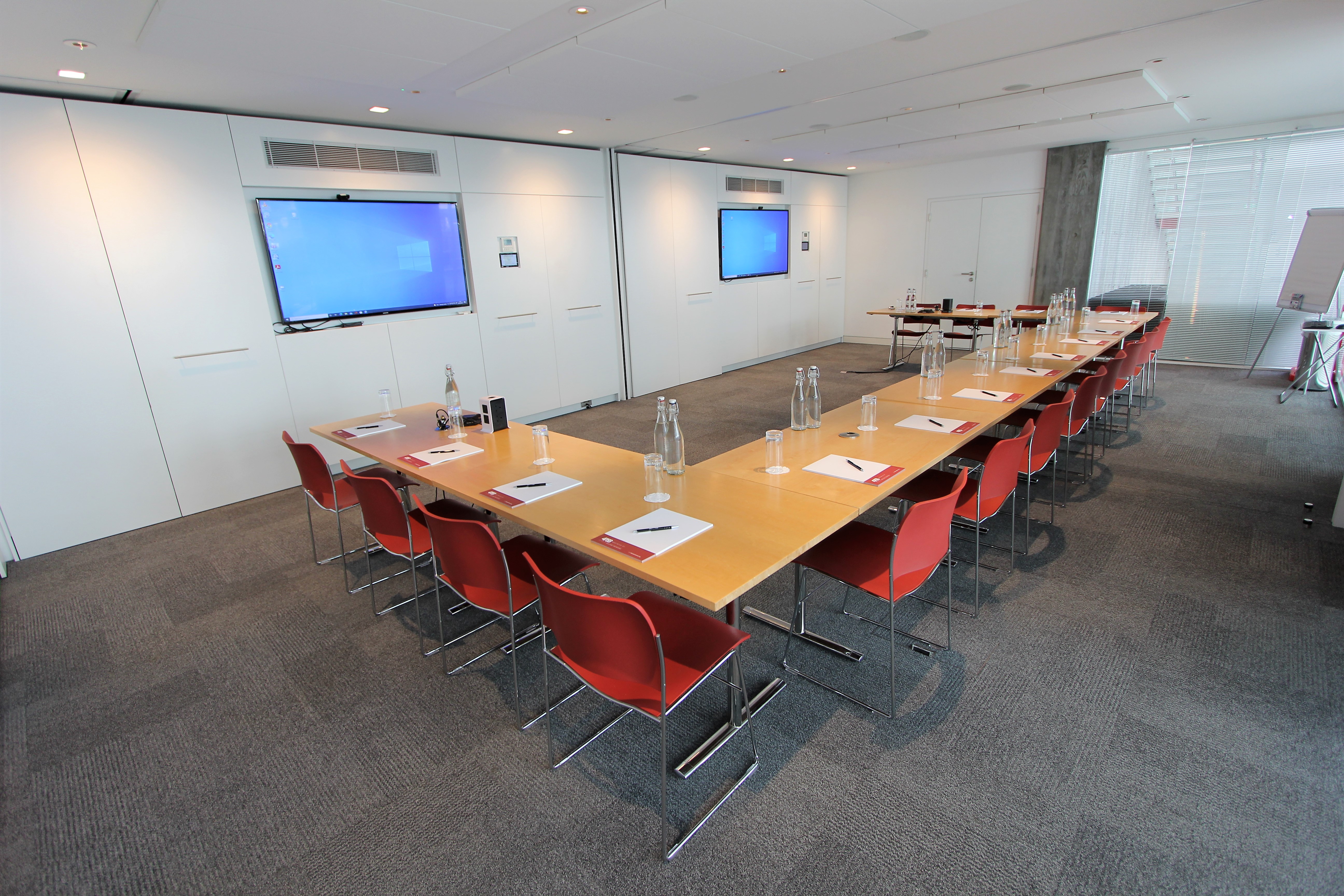 Belgrave Suite meeting room with modern decor, ideal for professional gatherings and presentations.