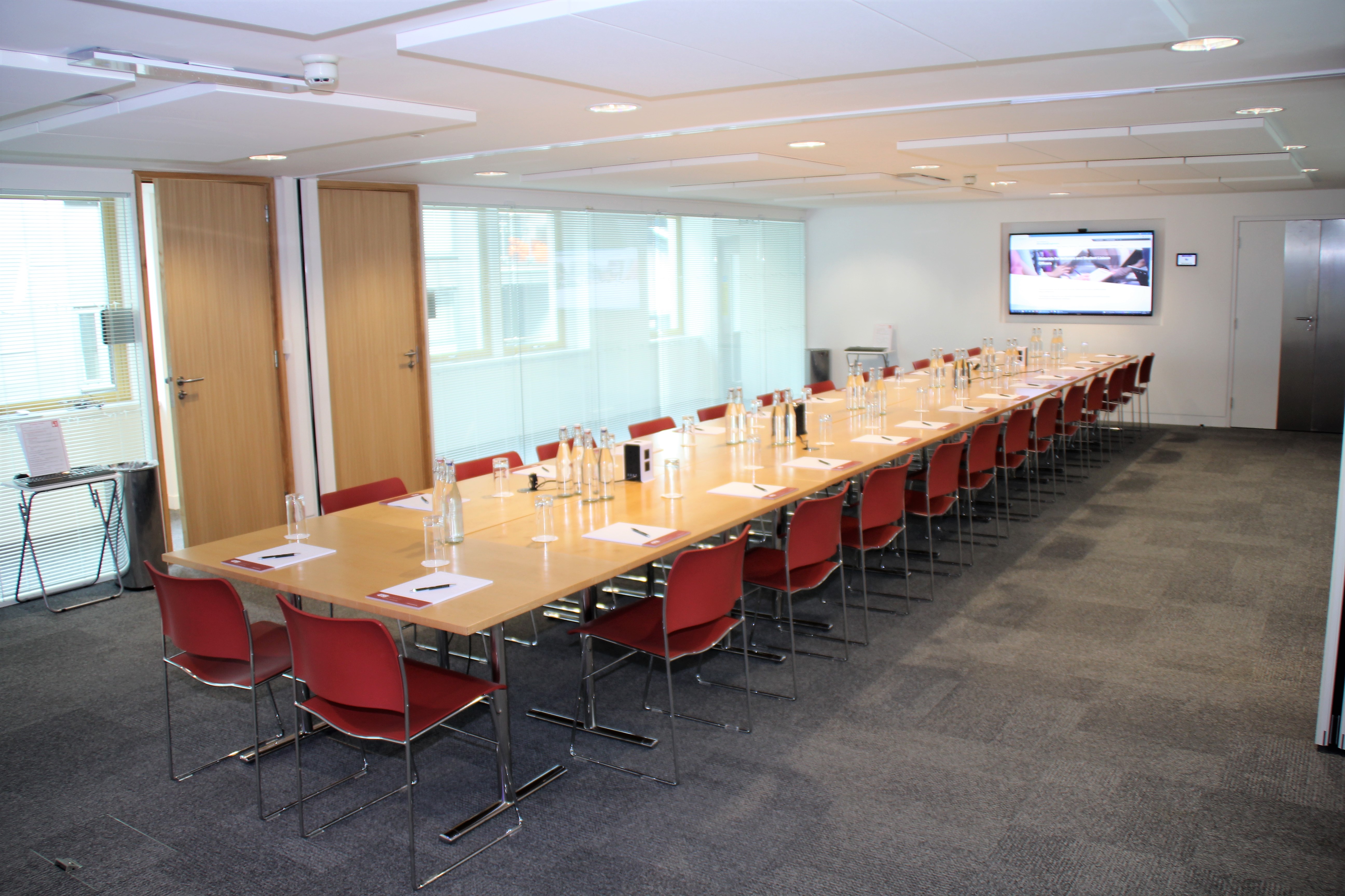 Bastwick Suite meeting room with long table, ideal for professional gatherings and events.