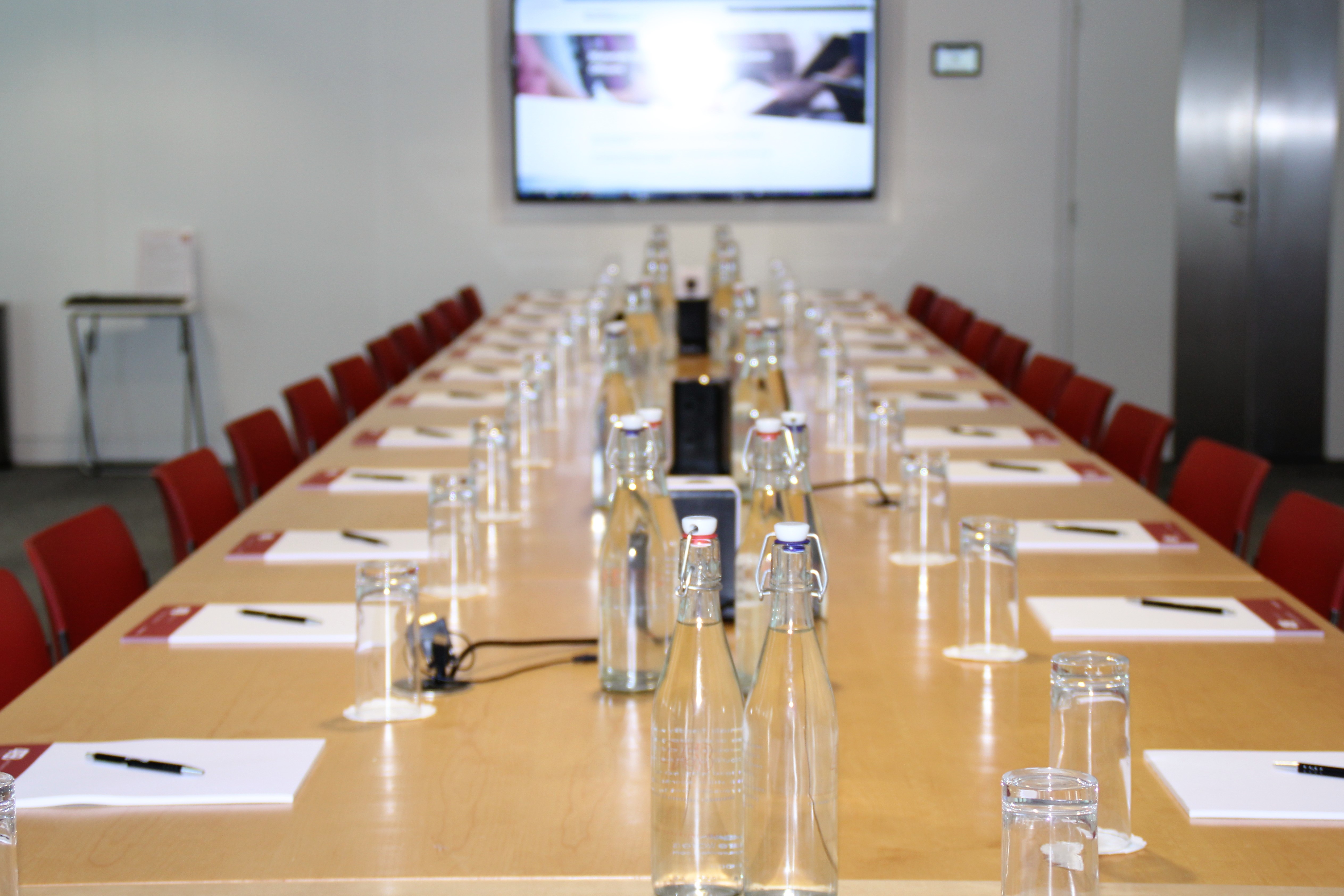 Bastwick Suite conference room with long table, ready for professional meetings and events.