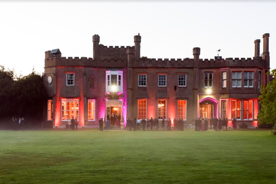 Stunning Nonsuch Mansion venue with castle-like exterior, ideal for events and receptions.