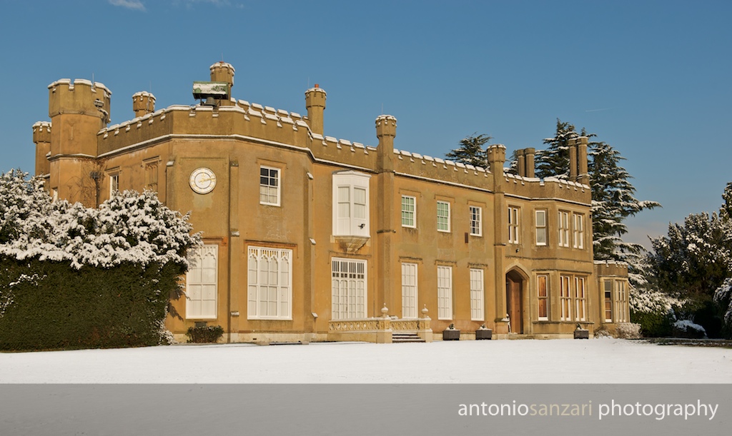 Historic Nonsuch Mansion venue in snow, perfect for winter events and gatherings.
