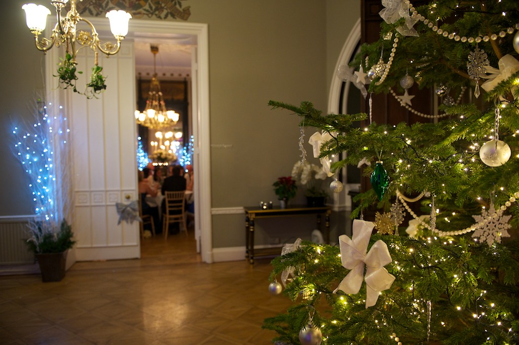 Elegant holiday event venue with a festive Christmas tree at Nonsuch Mansion.