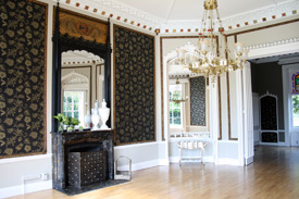 Elegant event space at Nonsuch Mansion with chandelier, perfect for upscale gatherings.