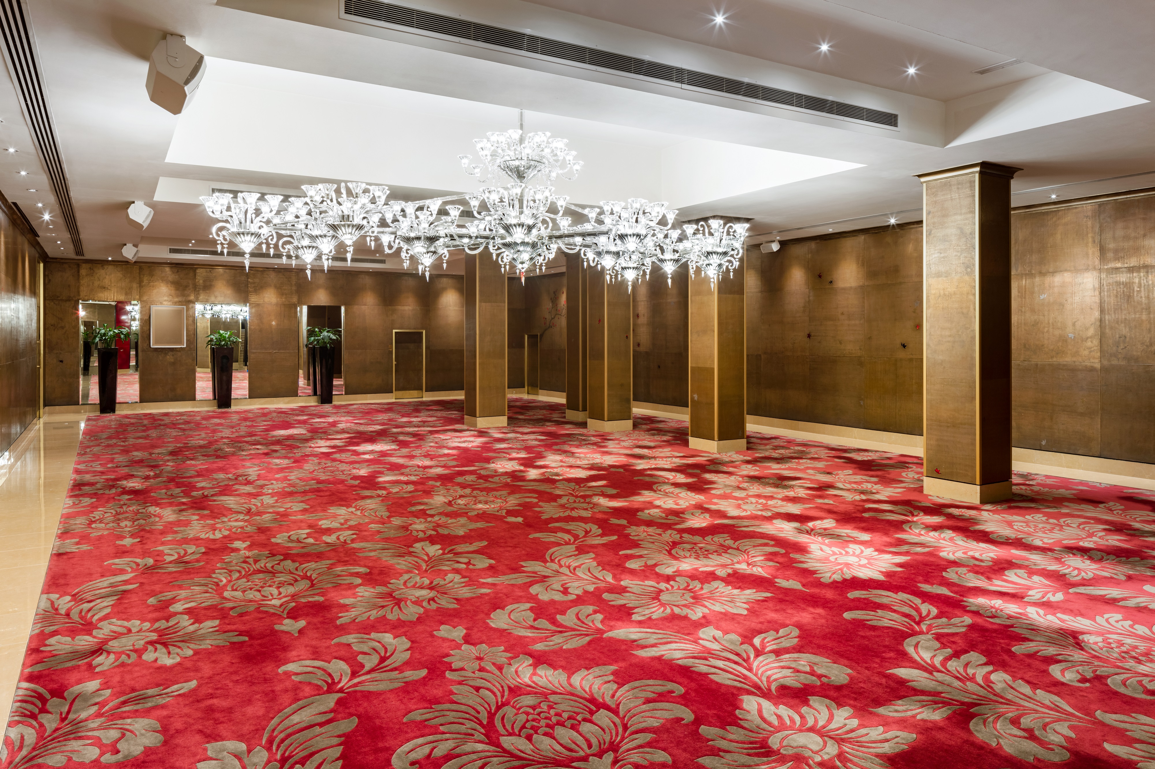 Elegant Crystal Room at The May Fair Hotel with luxurious red carpet for upscale events.