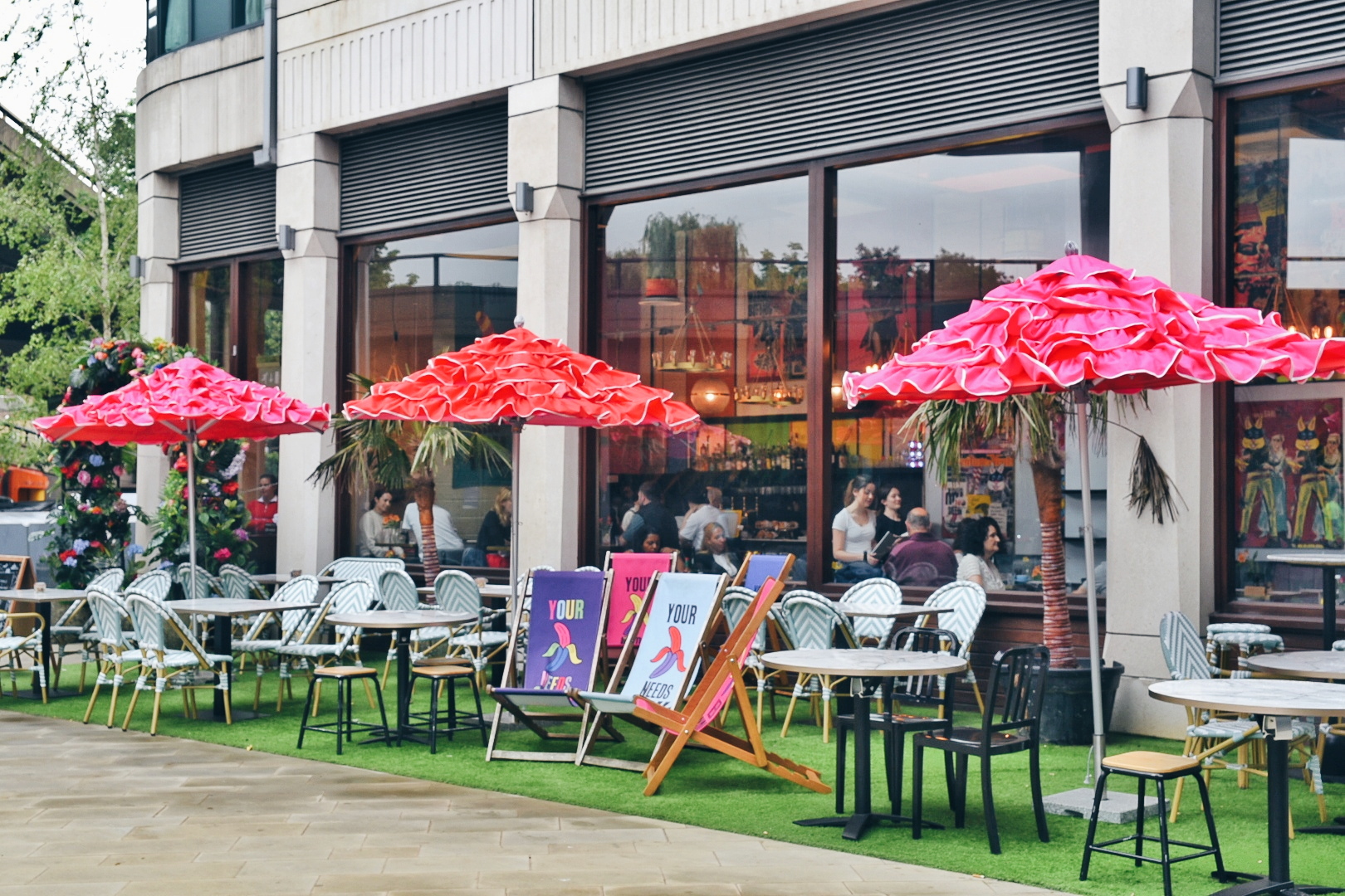 Vibrant outdoor venue with colorful umbrellas for casual meetings and summer events.
