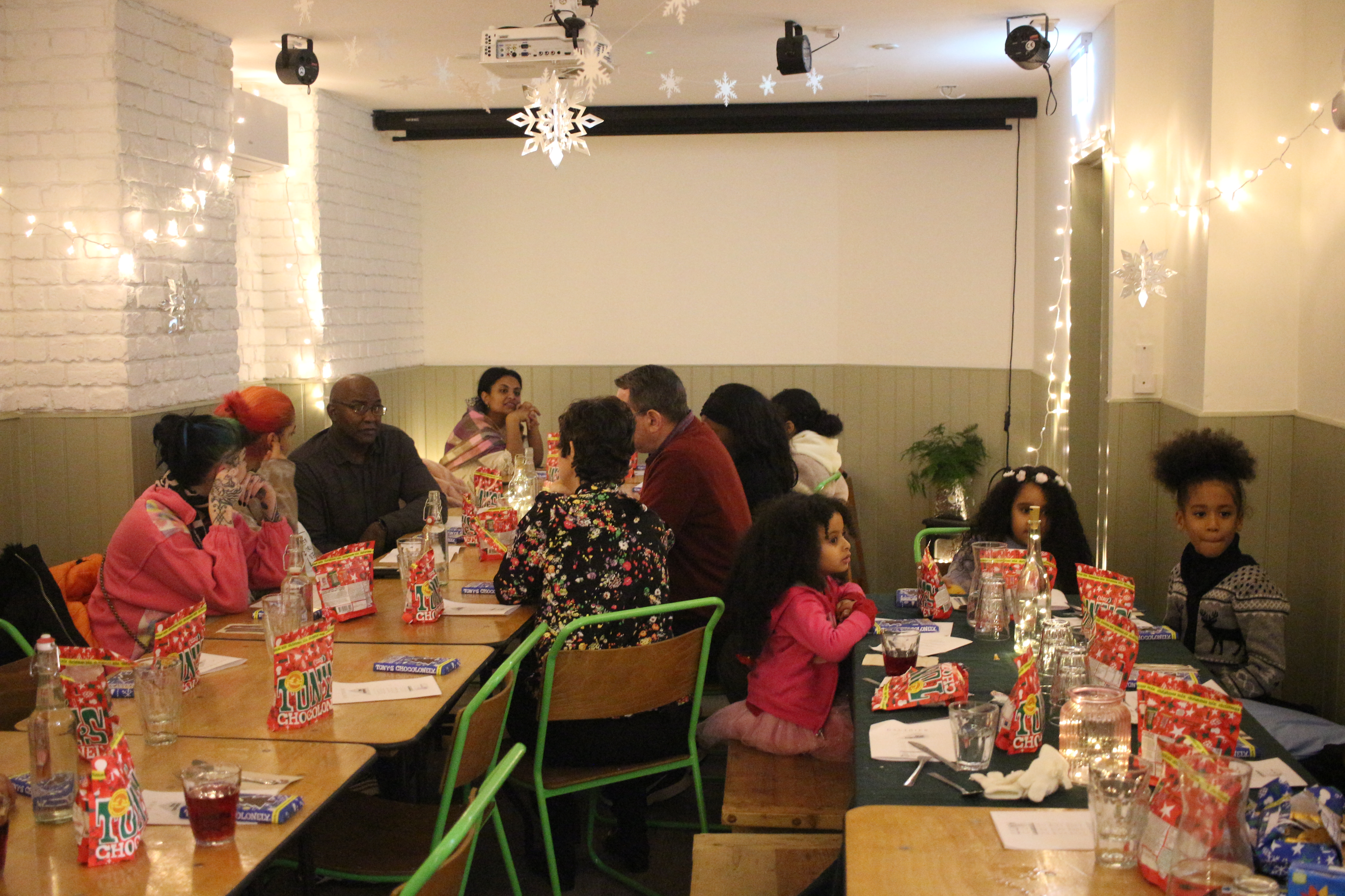 Cozy event space at The Canvas for family gatherings with festive table settings.