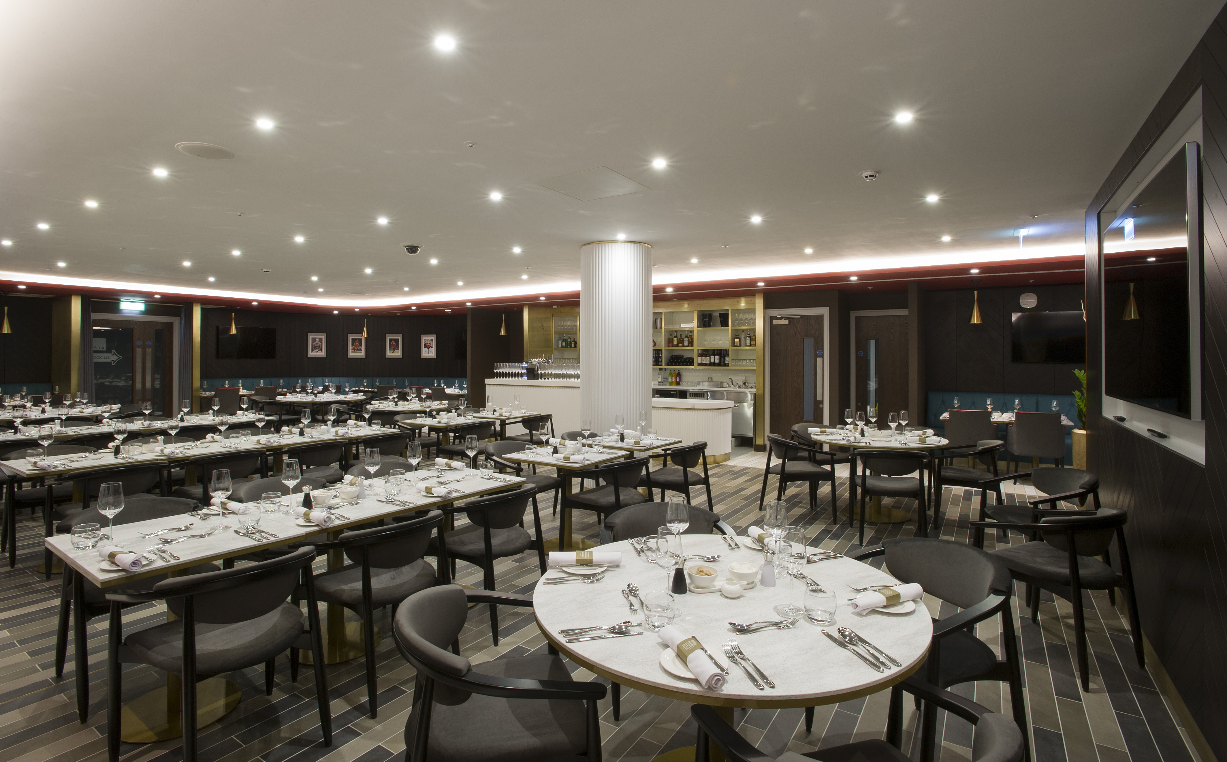 Legends Lounge at Liverpool FC: elegant dining space for events with modern decor.