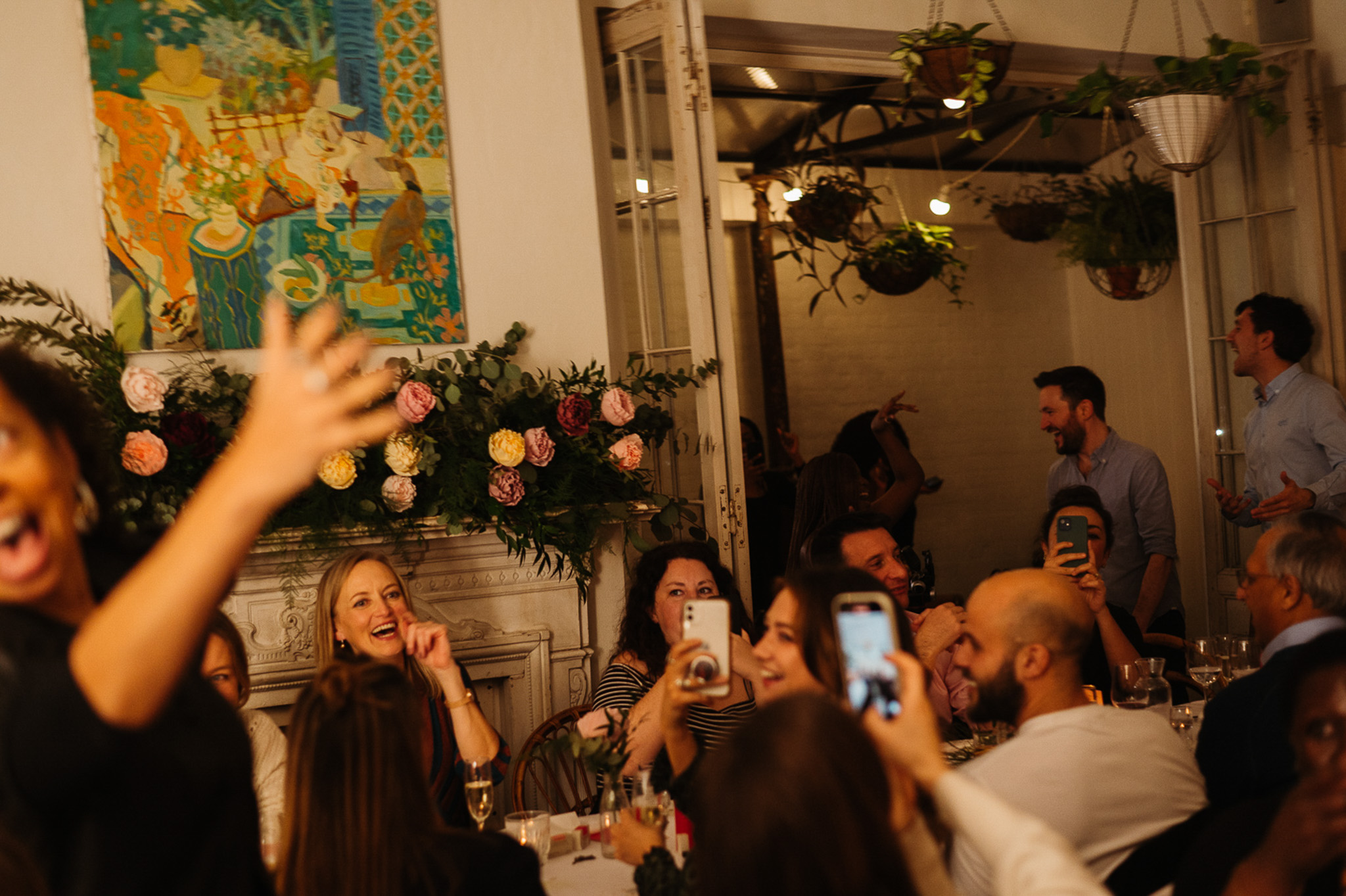 Lively Garden Room event with elegant floral arrangements and vibrant decor.