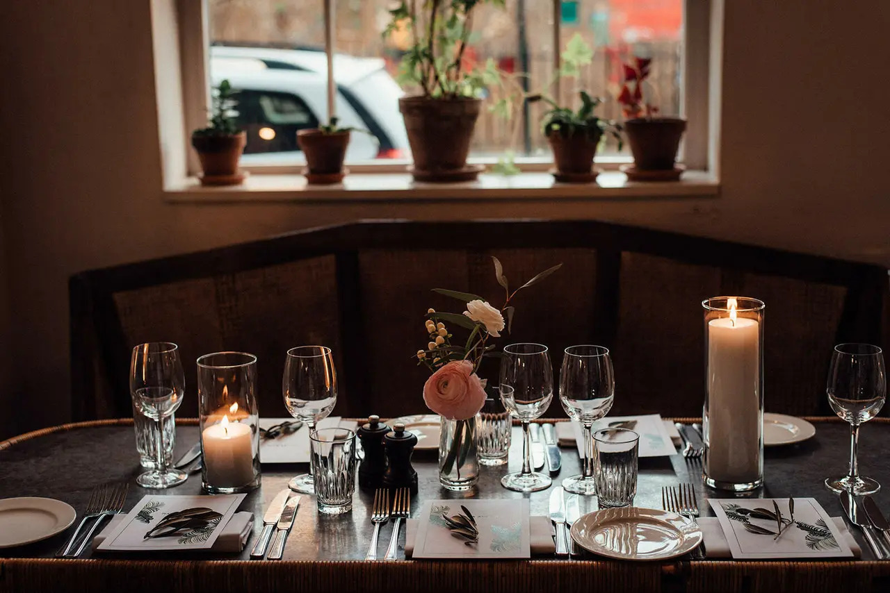 Elegant dining table with floral centerpieces for corporate dinners and gatherings.