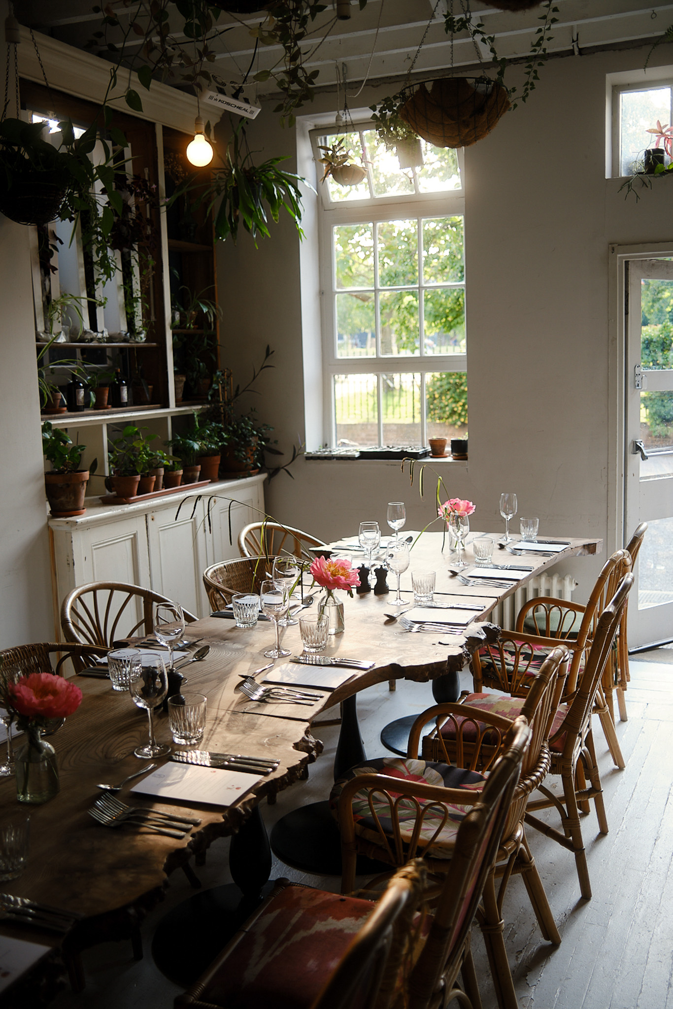 Private dining room with rustic wooden table, ideal for corporate meetings and intimate gatherings.
