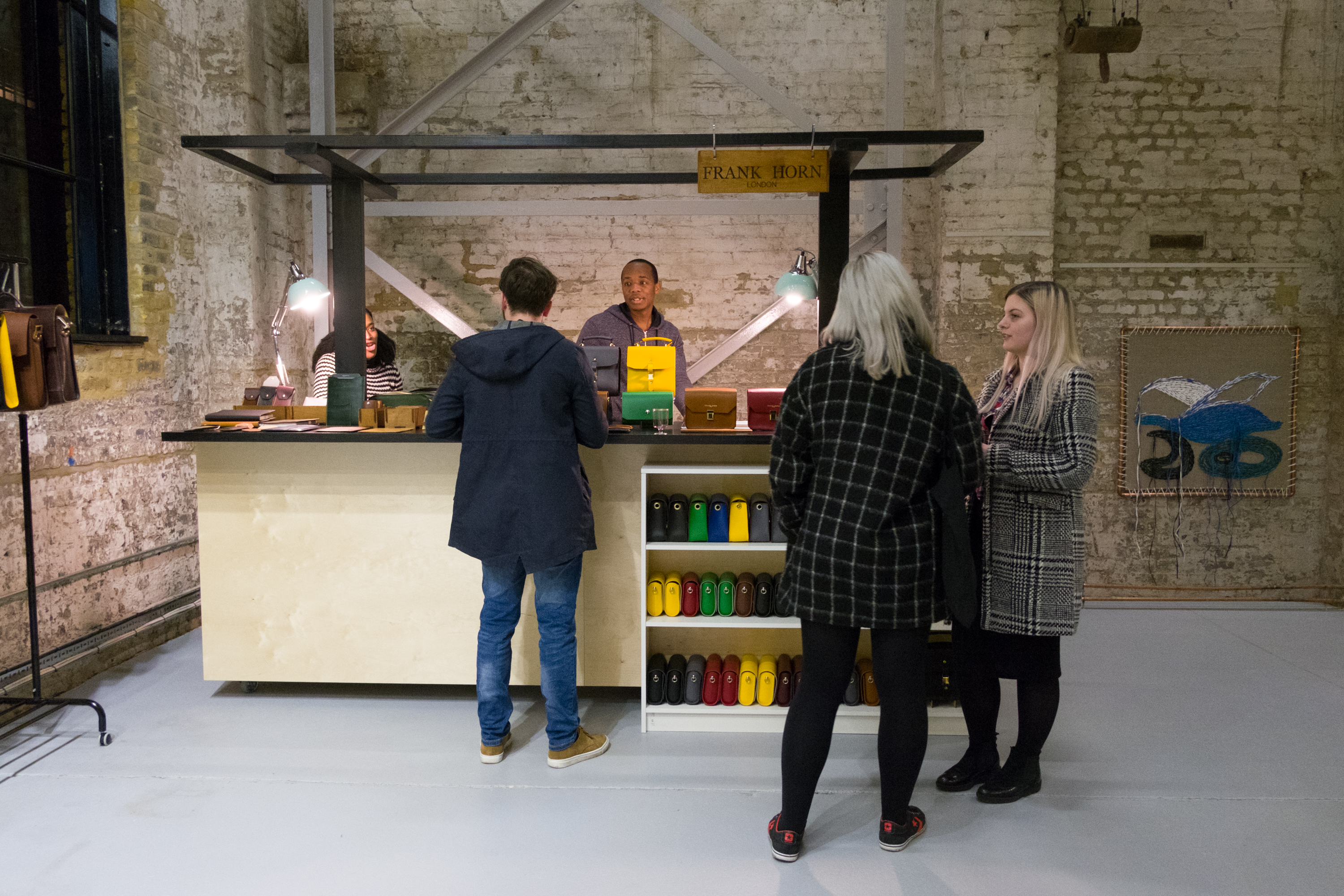 Vibrant Exhibition Hall in Craft Central with interactive service station for networking events.