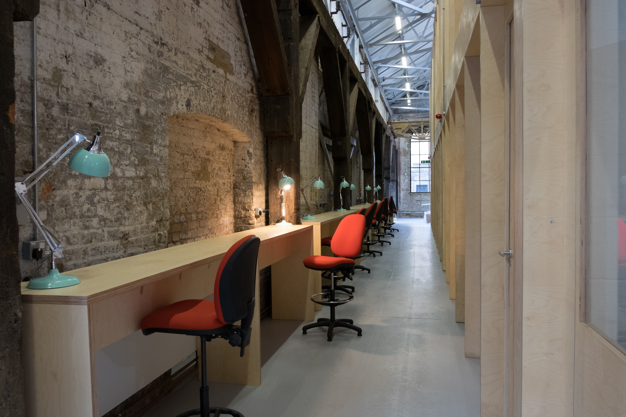 Multipurpose meeting rooms in Craft Central with ergonomic workstations for creative events.